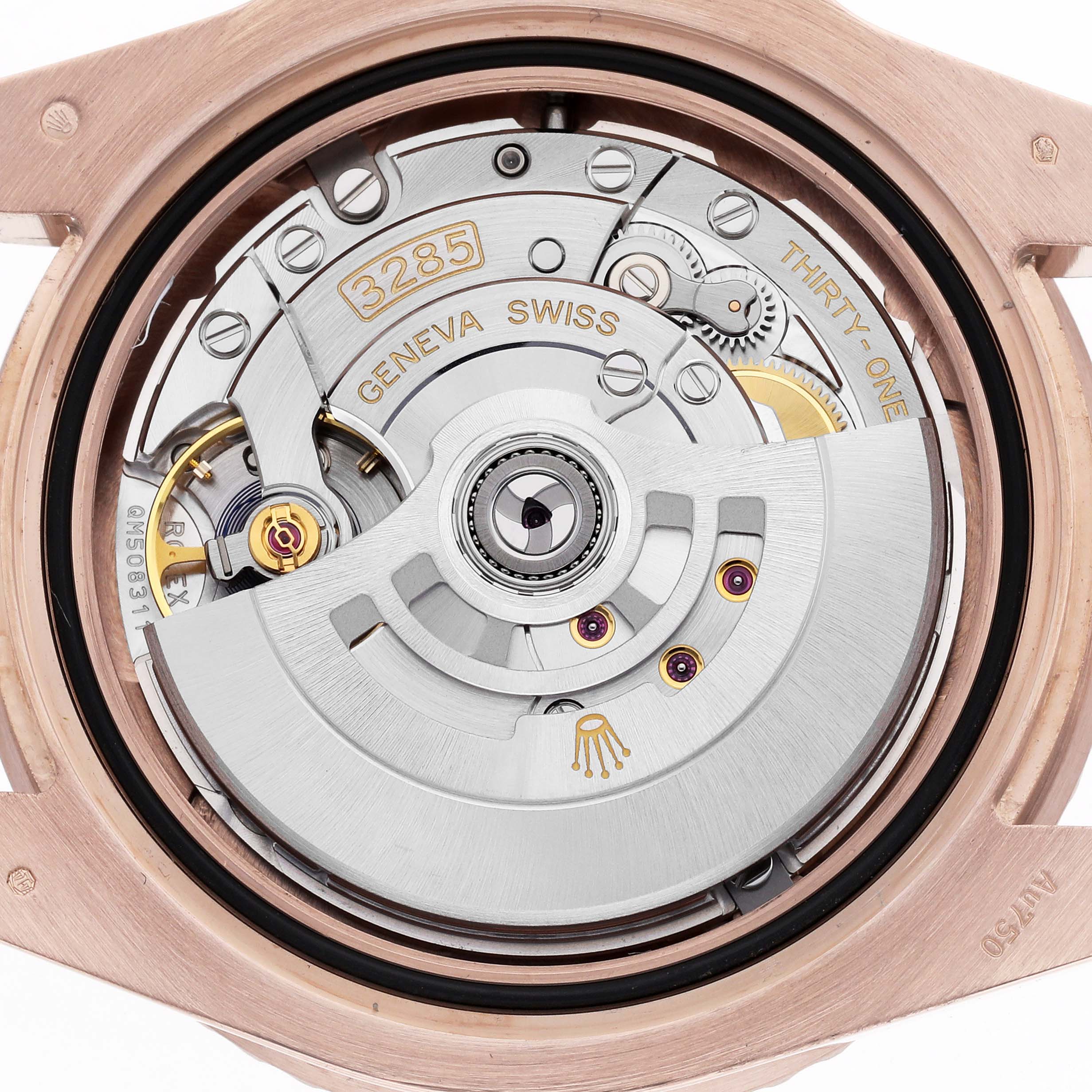 The image shows a close-up of the Rolex GMT-Master 126715 Men's Rose Gold Black Dial's movement, focusing on the rotor and intricate mechanics from a top-down angle.