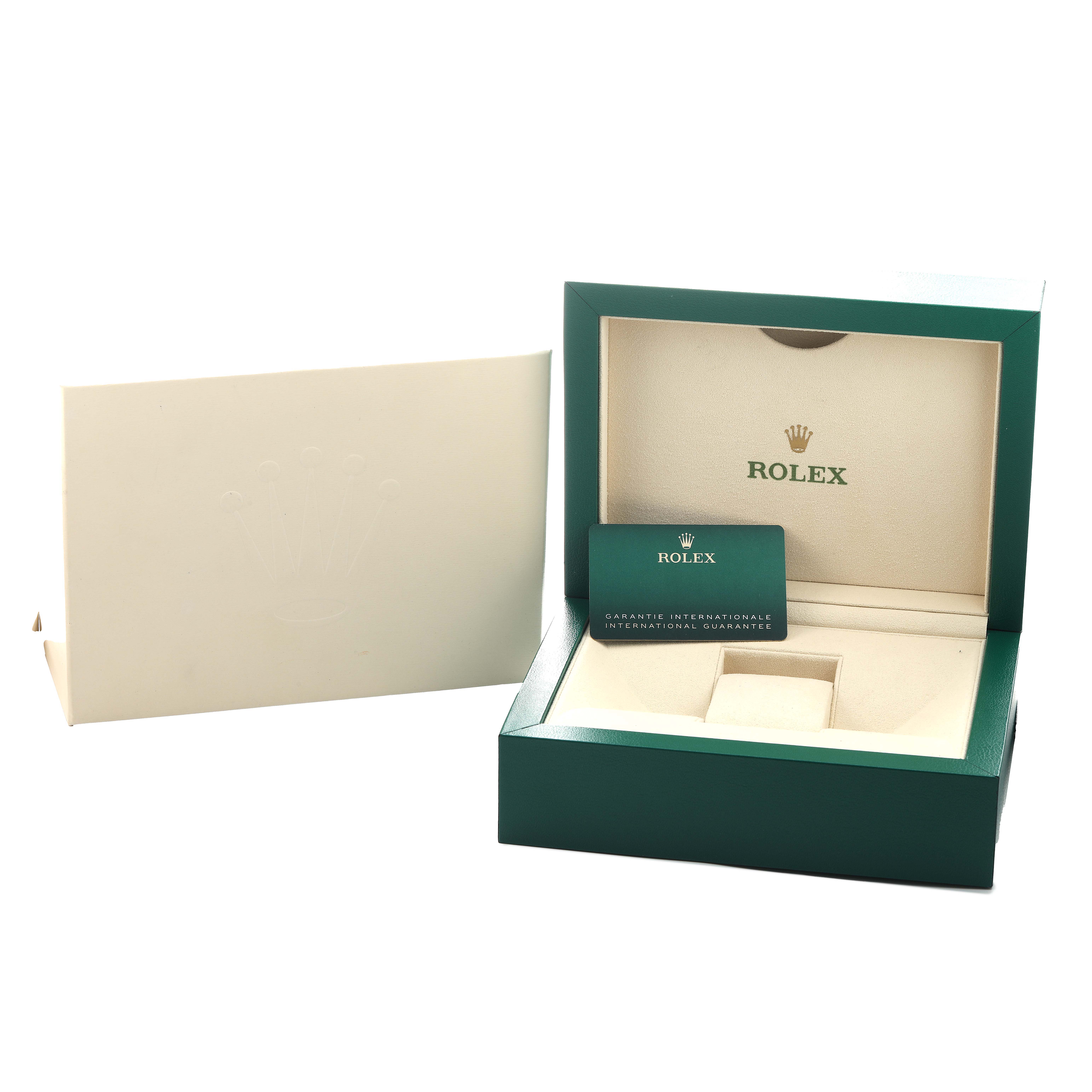 The image shows an open green box for a Rolex GMT-Master 126710 Men's Stainless Steel Black Dial model, including an international guarantee card.