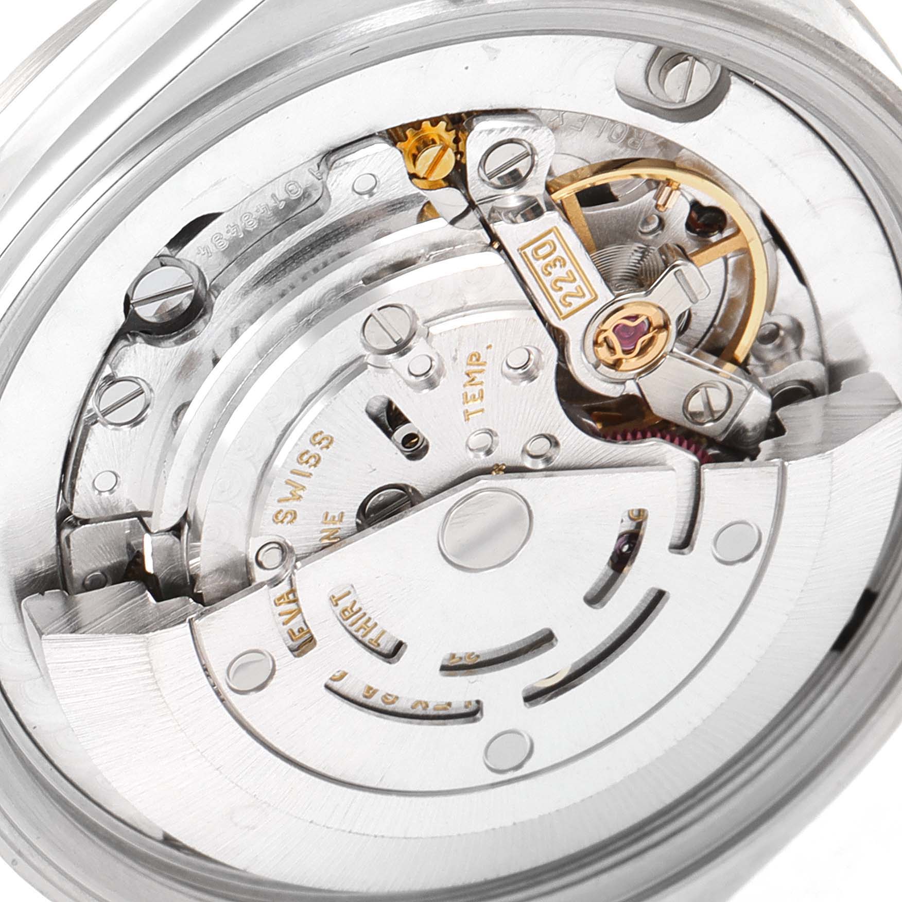 This close-up image shows the internal mechanical movement components of a mid-size Rolex watch.