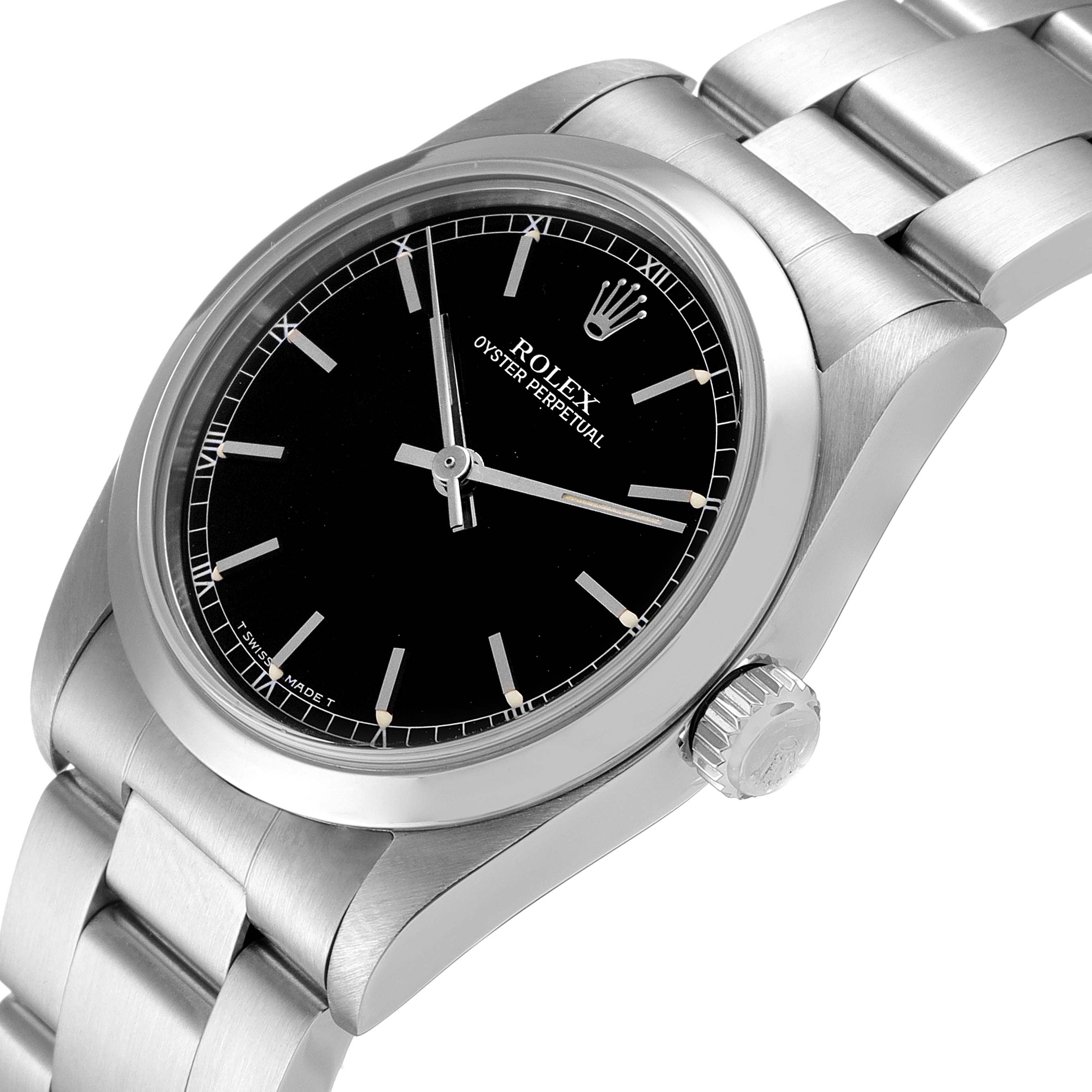The image shows a Mid-Size Rolex Oyster Perpetual watch, focusing on the dial and crown at a slight angle.