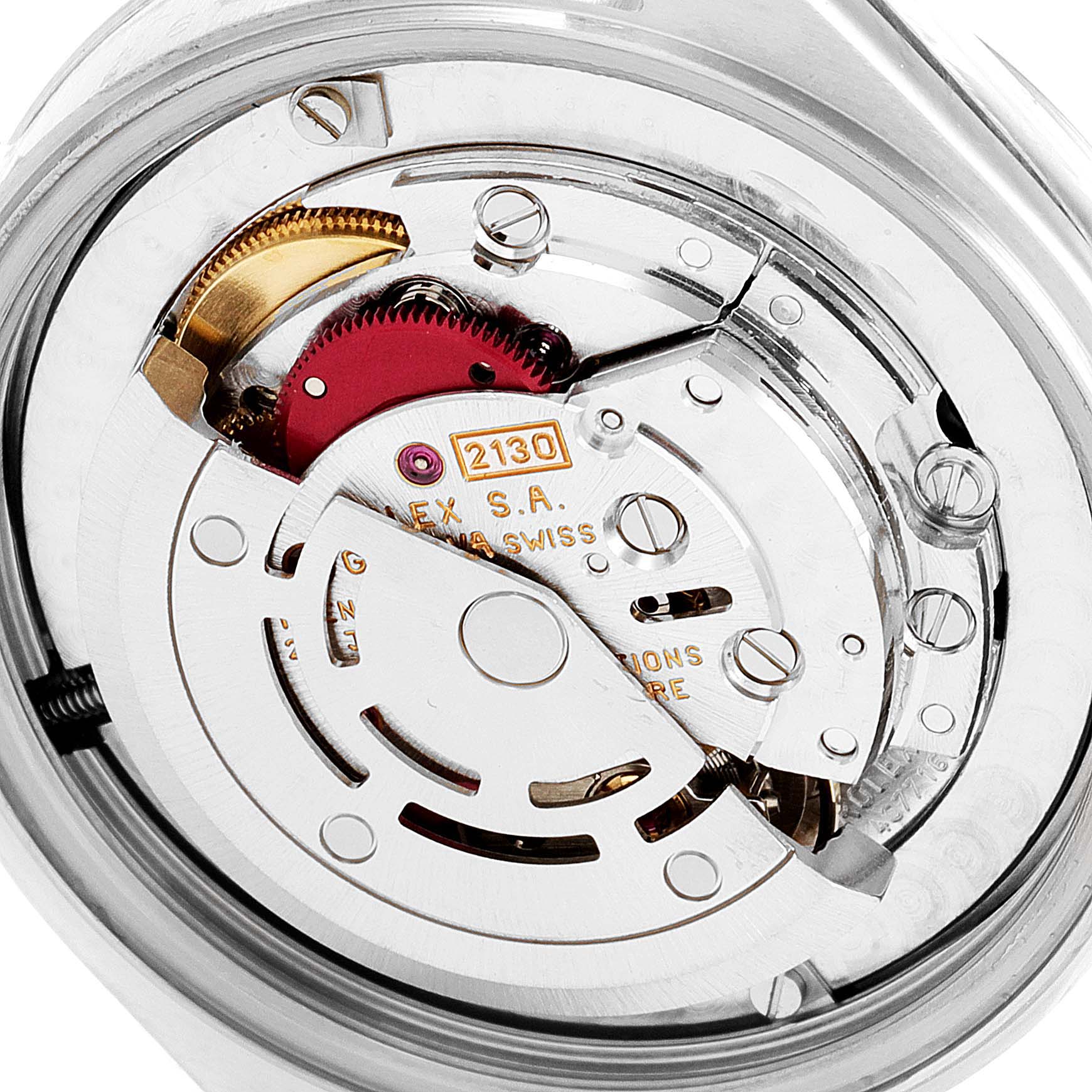 The image shows a close-up of the movement assembly in a Mid-Size Rolex watch, highlighting gears and mechanical components.