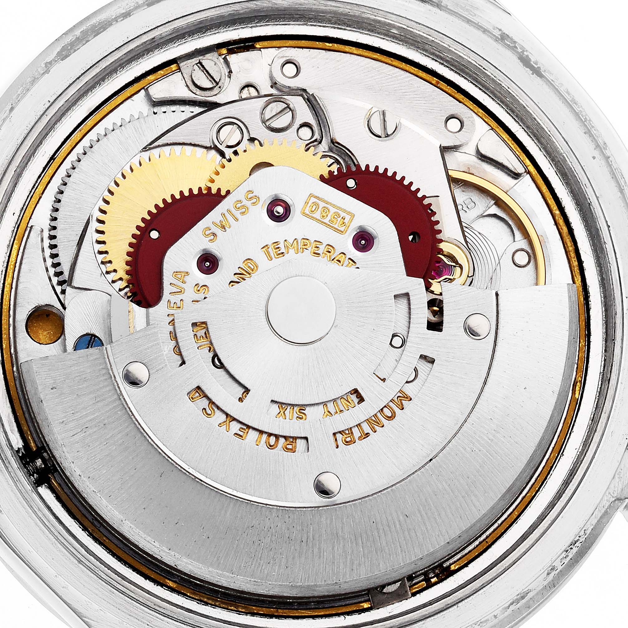 The image shows an overhead view of the Rolex Vintage Collection 1019 Men's Stainless Steel Black Dial watch movement, highlighting gears and inner mechanisms.