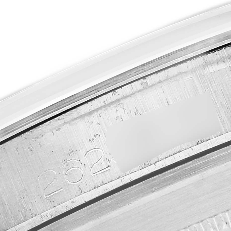 The image shows a close-up of the inner rim of a Rolex Vintage Collection 1019 Men's Stainless Steel Black Dial model, highlighting the serial number engraving.