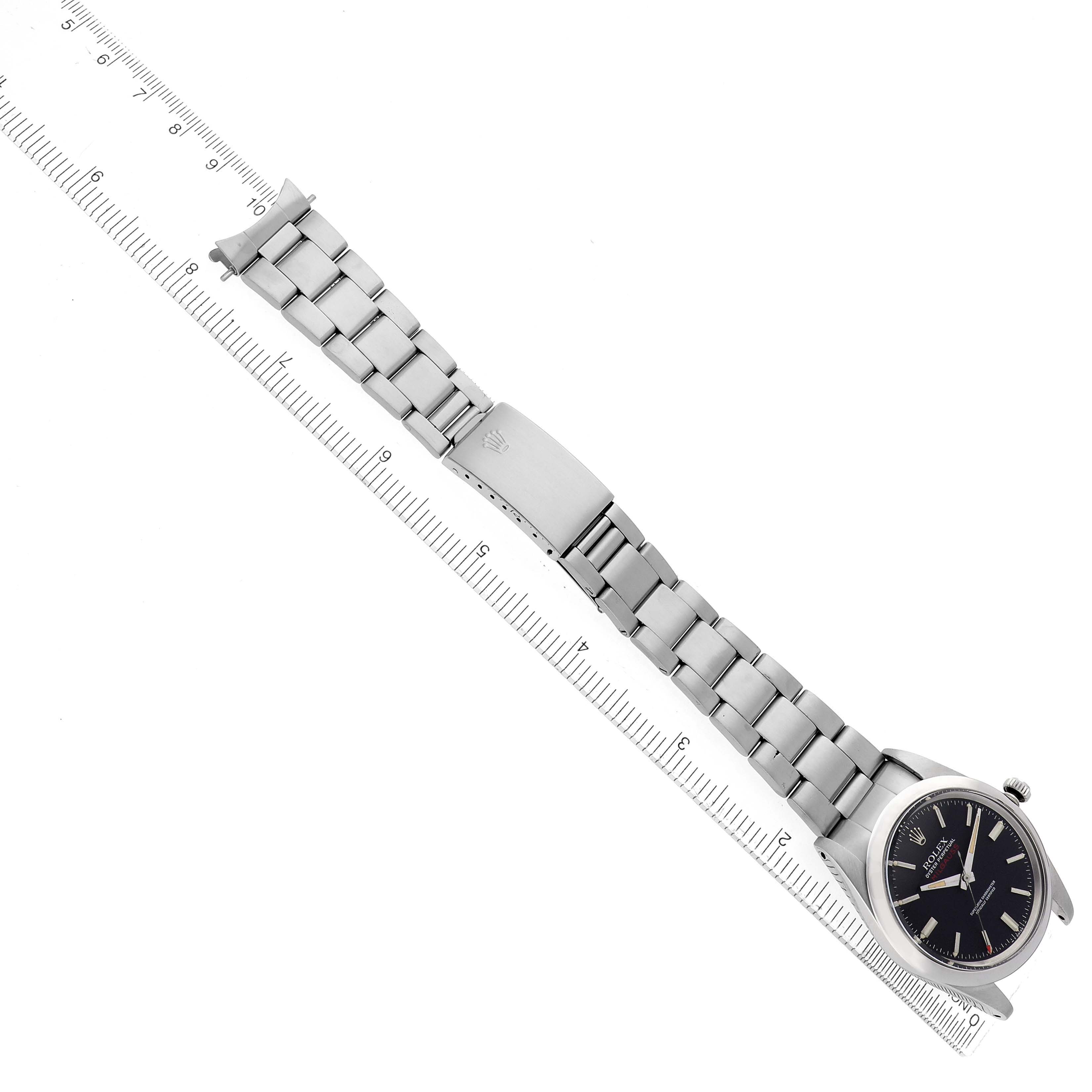 The image shows a side angle of a Rolex Vintage Collection 1019 Men's Stainless Steel Black Dial watch with its full bracelet and clasp aligned alongside a ruler.