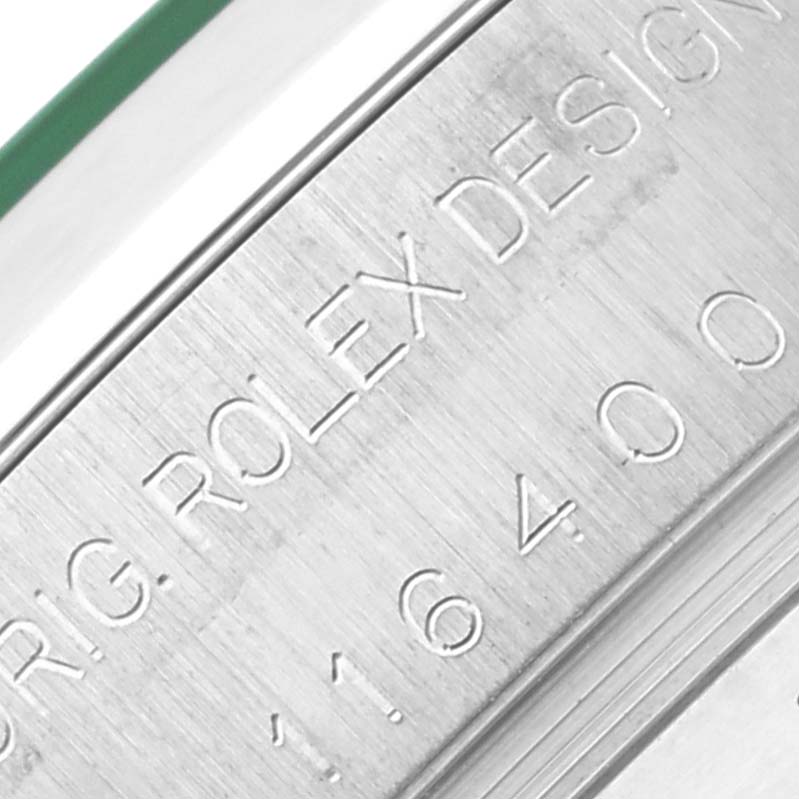The image shows a close-up of the engraved side of a Rolex Milgauss 116400 Men's Stainless Steel Black Dial 116400 Men's Stainless Steel Black Dial watch case with model number 116400.