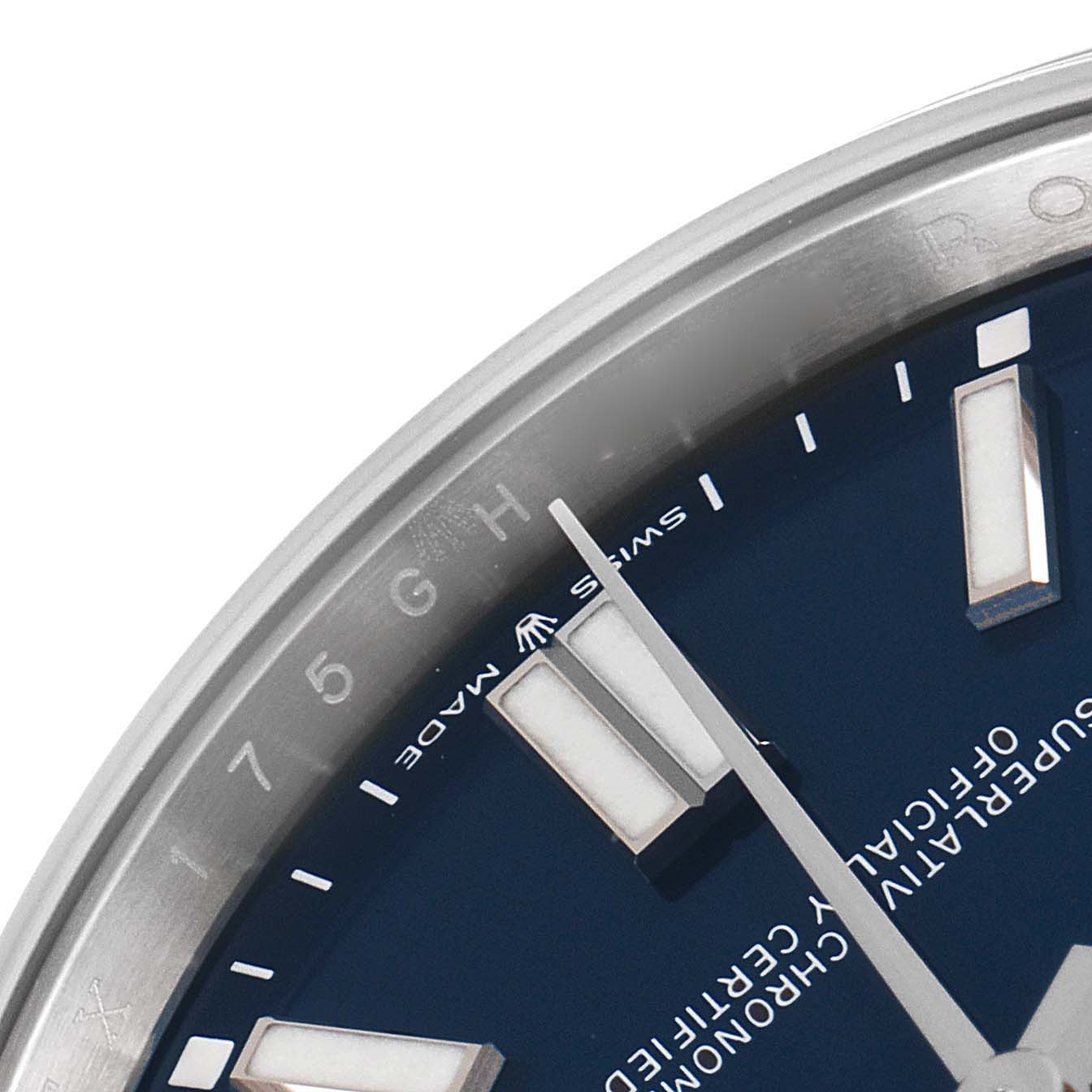 This image shows a close-up of the dial and part of the bezel of a Rolex Oyster Perpetual 124300 Men
s Stainless Steel Blue Dial 124300 Men
s Stainless Steel Blue Dial watch.