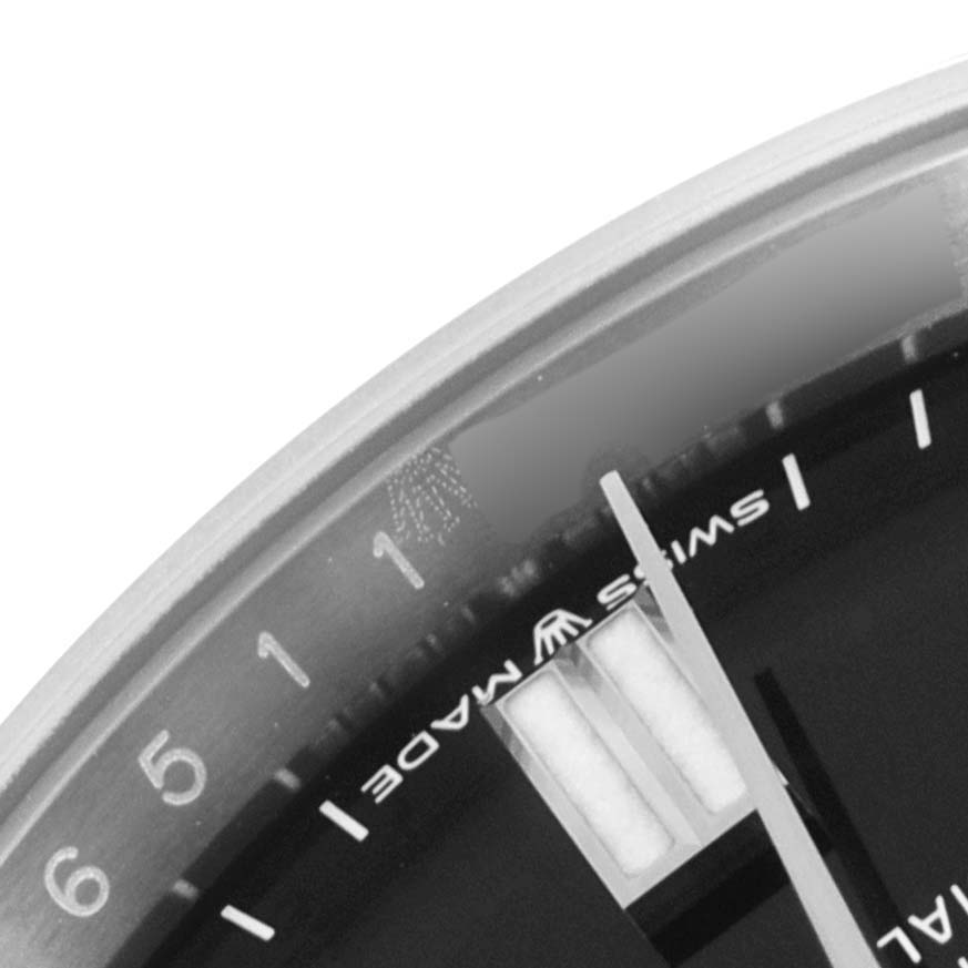 This image shows a close-up of the dial and the "Swiss Made" text on a Rolex Oyster Perpetual 126000 Men
s Stainless Steel Black Dial 126000 Men
s Stainless Steel Black Dial watch.