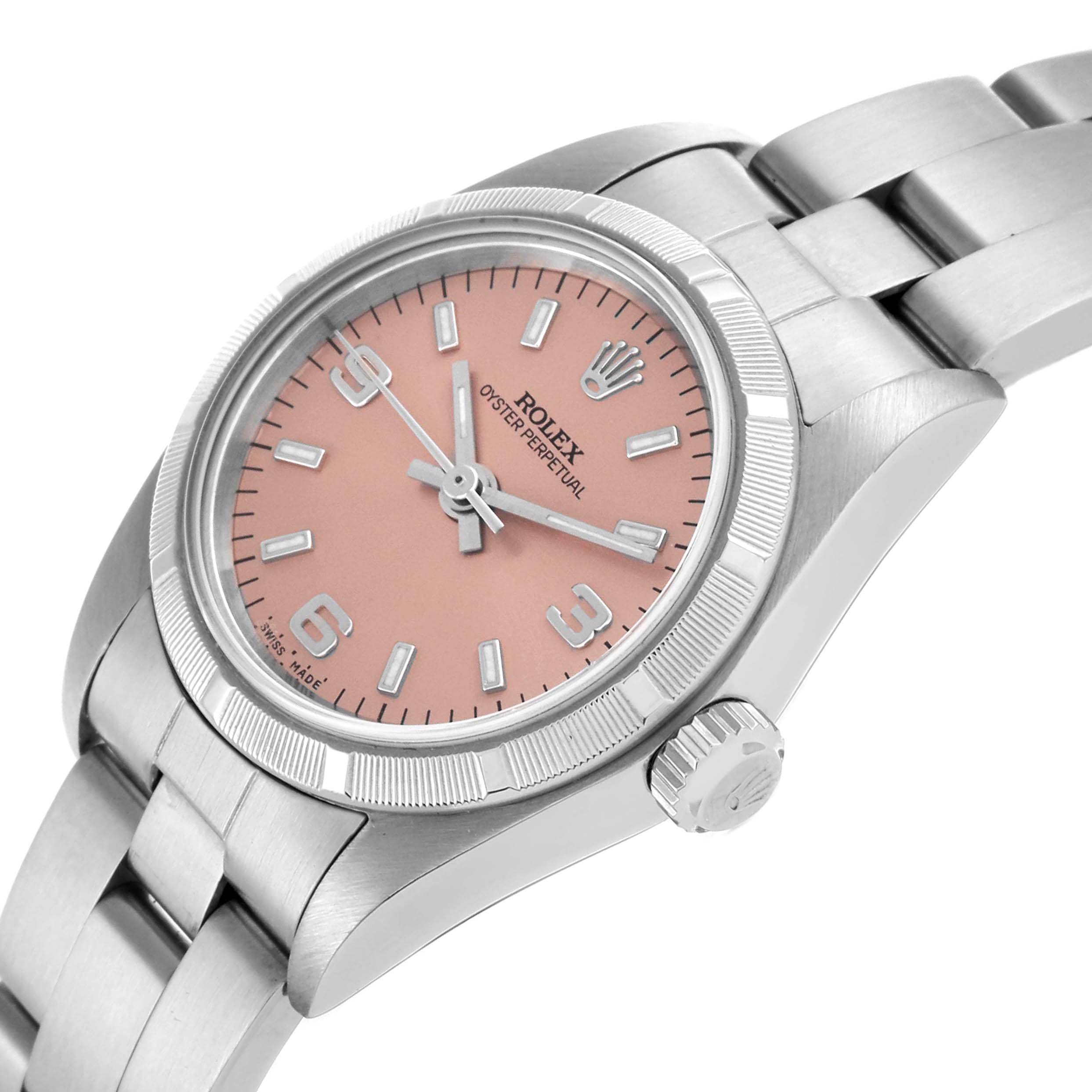 The Rolex Oyster Perpetual 76030 Women's Stainless Steel Pink Dial 76030 Women's Stainless Steel Pink Dial watch is shown at a tilted angle, highlighting the dial, case, crown, and part of the bracelet.