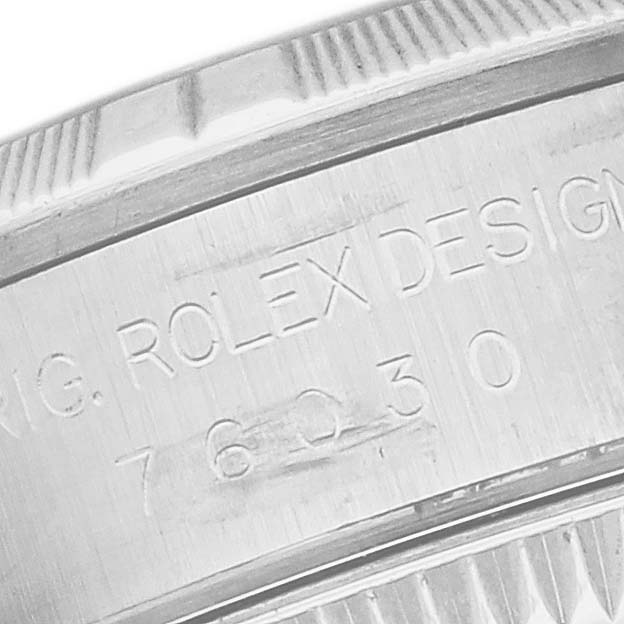 This image shows a close-up of the side engraving on a Rolex Oyster Perpetual 76030 Women's Stainless Steel Pink Dial 76030 Women's Stainless Steel Pink Dial watch bezel or case.