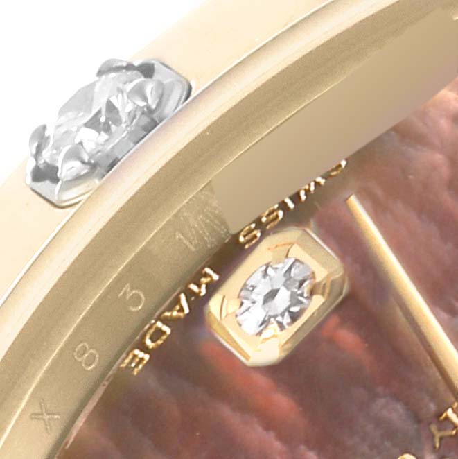 The image shows a close-up of the dial and bezel of the Rolex Pearlmaster 81318 Women's Yellow Gold Mother of Pearl Dial 81318 Women's Yellow Gold Mother of Pearl Dial watch, highlighting its diamonds and gold elements.