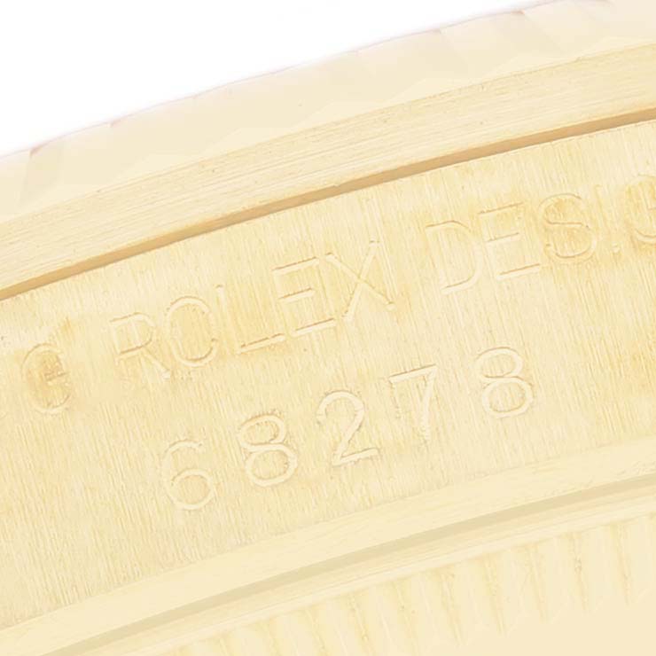 This close-up image shows the engraving on the Rolex President 68278 Women
s Yellow Gold Champagne Dial 68278 Women
s Yellow Gold Champagne Dial model
s case.