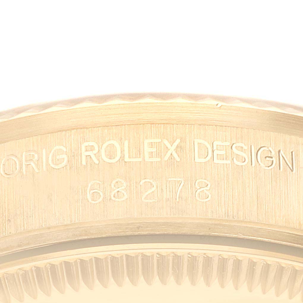 The image shows a close-up of the engraved case side of a Rolex President 68278 Women's Yellow Gold Black Dial 68278 Women's Yellow Gold Black Dial model.