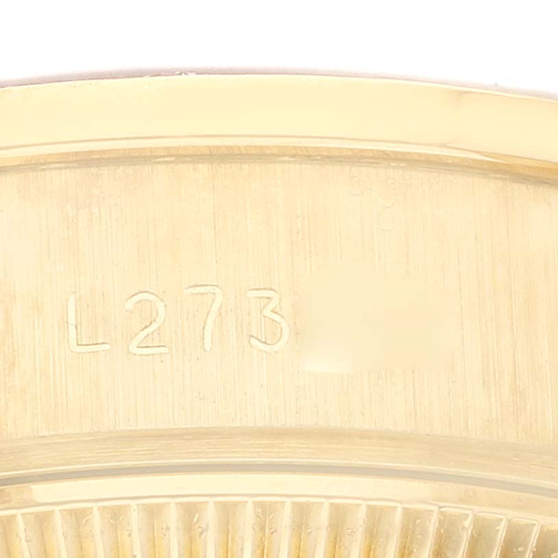 This image shows a close-up of the caseback, particularly the serial number area, of the Rolex President 69138G Women
s Yellow Gold Champagne Dial 69138G Women
s Yellow Gold Champagne Dial model watch.