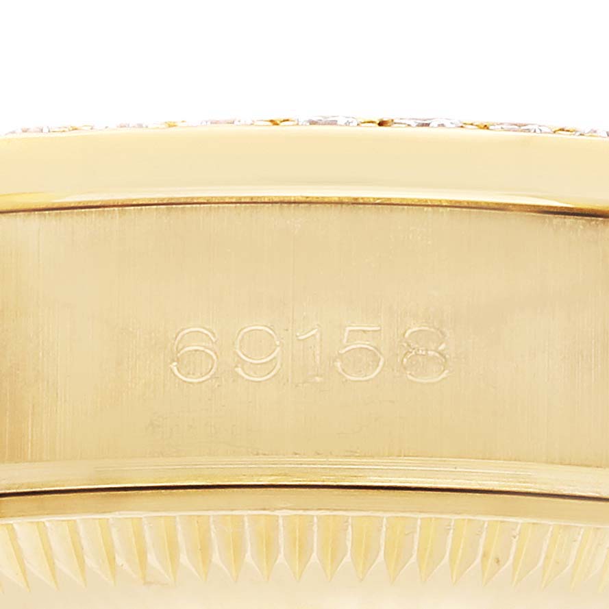 The image shows a close-up of the side of a Rolex President 69158 Women's Yellow Gold Champagne Dial watch, focusing on the case with "69158" engraved on it.