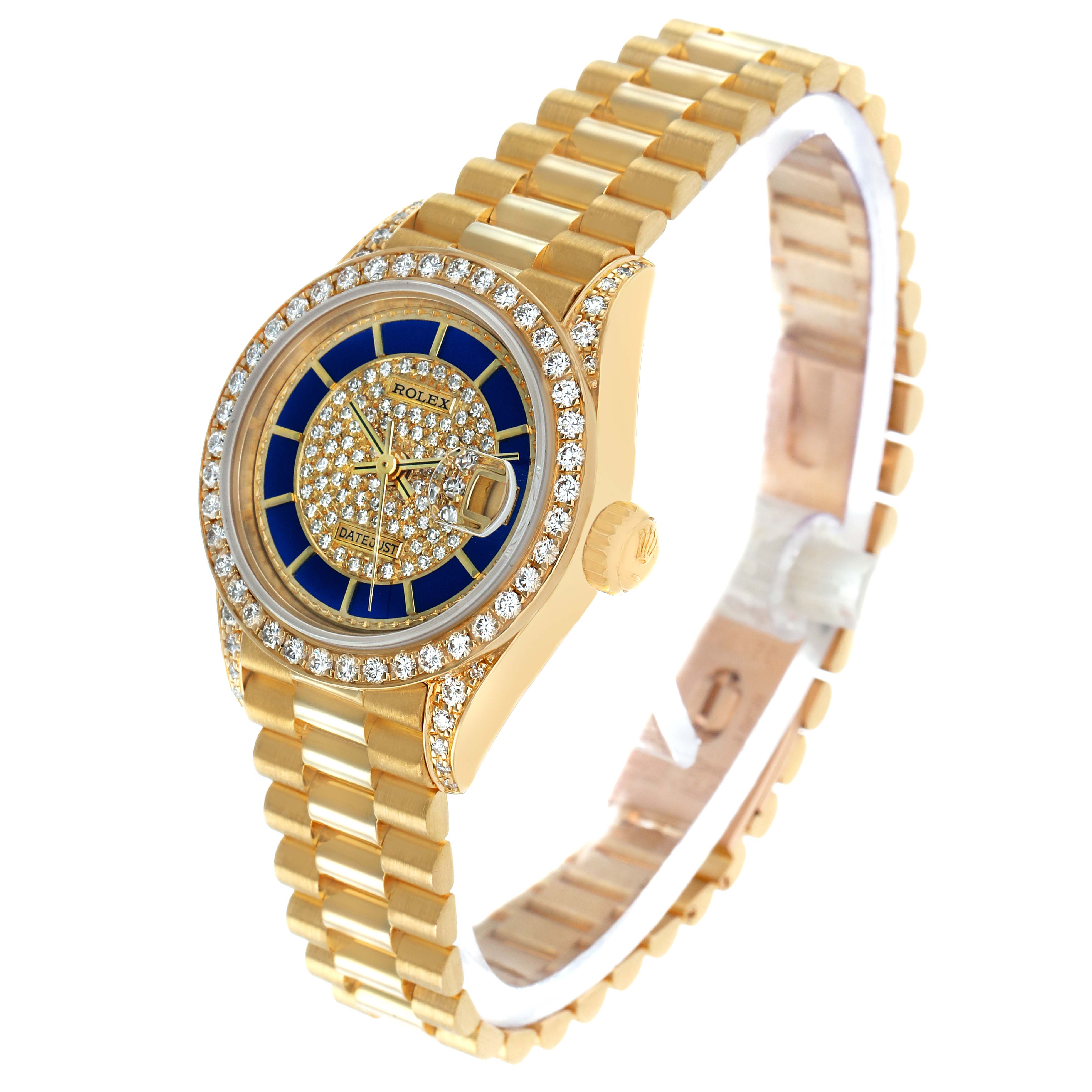 The Rolex President 69158 Women's Yellow Gold Champagne Dial watch is shown at an oblique angle, highlighting its gold bracelet, blue and diamond dial, and bezel.