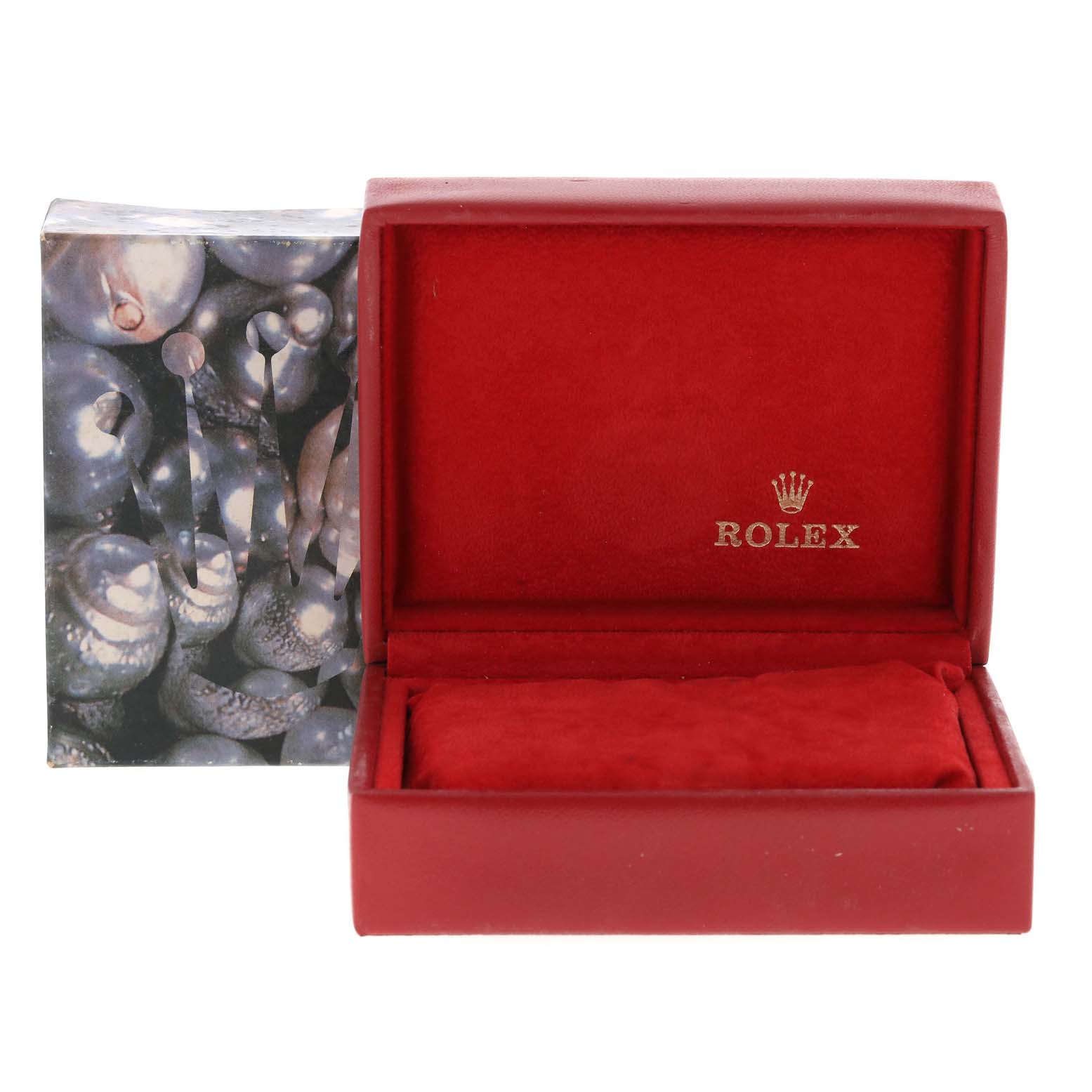The image shows an open Rolex watch box with red interior, likely for the President model, along with the outer packaging.