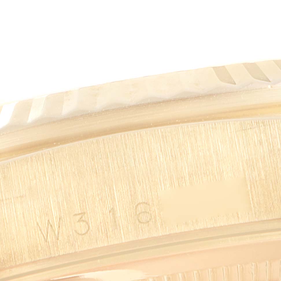 This close-up image shows the serial number and edge of the bezel on a Rolex President 18238 Men's Yellow Gold Champagne Dial 18238 Men's Yellow Gold Champagne Dial model watch.