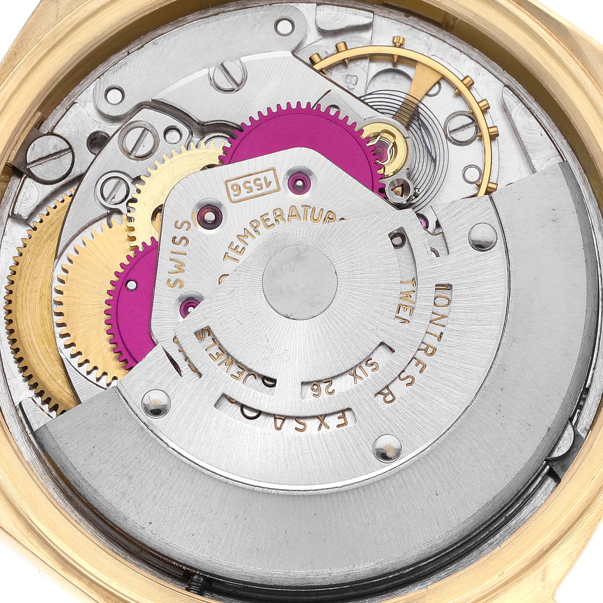 The image shows the inner mechanics of the Rolex Vintage Collection 1803 Men's Yellow Gold Silver Dial 1803 Men's Yellow Gold Silver Dial model watch from a back view, focusing on gears and the rotor.