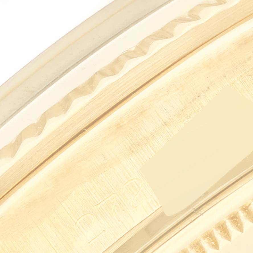 This image shows a close-up of the side of a Rolex Vintage Collection 1803 Men's Yellow Gold Silver Dial 1803 Men's Yellow Gold Silver Dial watch case, focusing on the edge and part of the serial number.