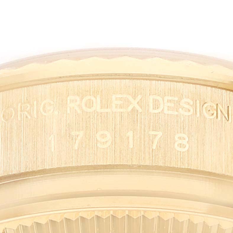 This image shows a close-up of the case side and engraved serial number of a Rolex President 179178 Women's Yellow Gold Mother of Pearl Dial 179178 Women's Yellow Gold Mother of Pearl Dial model watch.