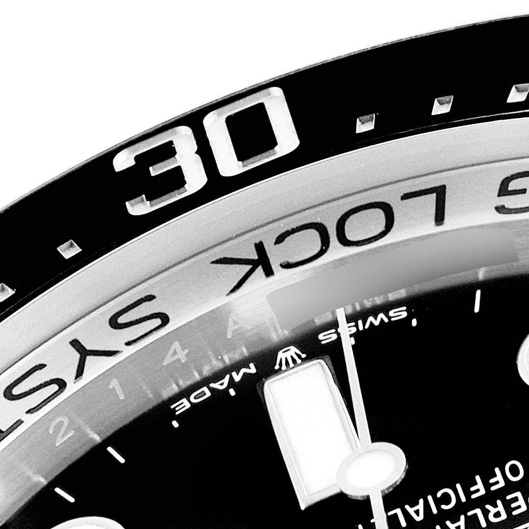 The image shows a close-up of the bezel and part of the dial of a Rolex Sea-Dweller 126660 Men's Stainless Steel Blue Dial 126660 Men's Stainless Steel Blue Dial watch.