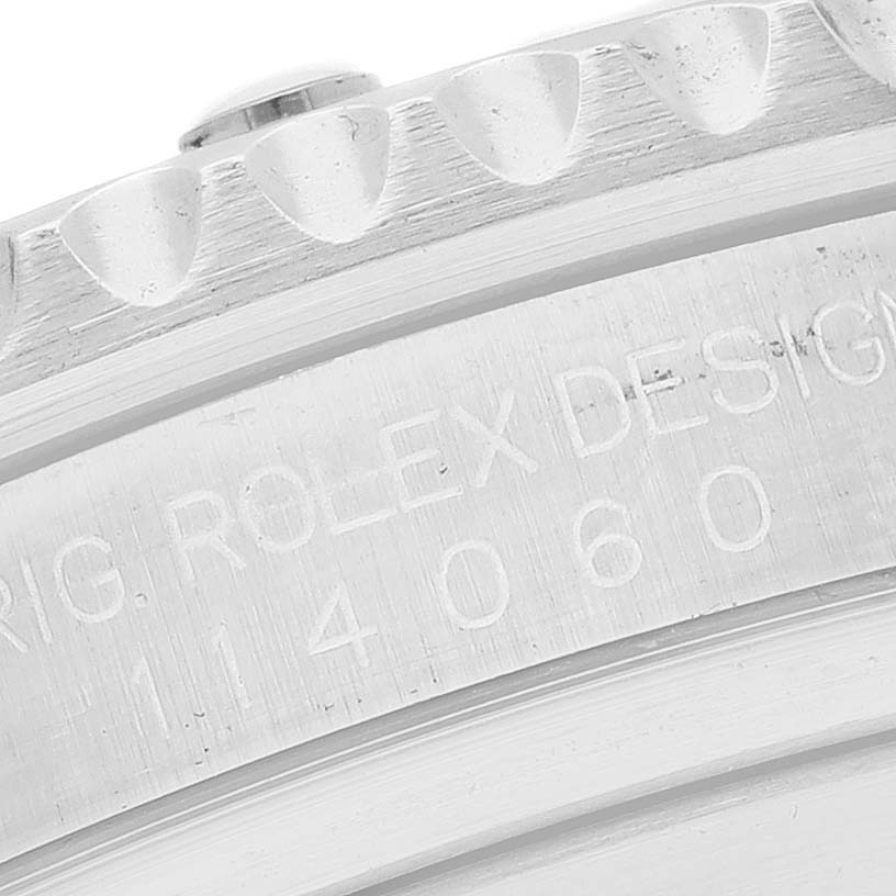 This close-up image shows the engraved bezel and case edge of the Rolex Submariner 114060 Men's Stainless Steel Black Dial 114060 Men's Stainless Steel Black Dial watch.