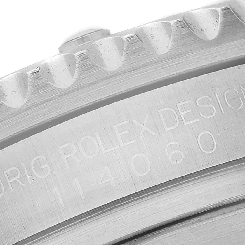 The image shows a close-up angle of the case side, bezel, and part of the crown of a Rolex Submariner 114060 Men
s Stainless Steel Black Dial 114060 Men
s Stainless Steel Black Dial watch.