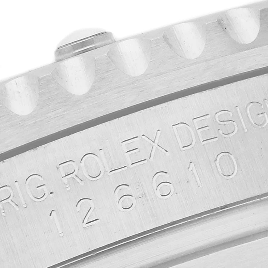 The image shows a close-up of the bezel and case edge of a Rolex Submariner 126610LN Men
s Stainless Steel Black Dial 126610LN Men
s Stainless Steel Black Dial, highlighting its engravings.
