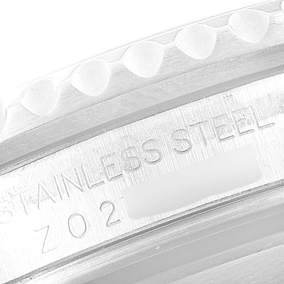 This image shows a close-up of the stainless steel bezel and case back edge of a Rolex Submariner 16610 Men
s Stainless Steel Black Dial 16610 Men
s Stainless Steel Black Dial watch.