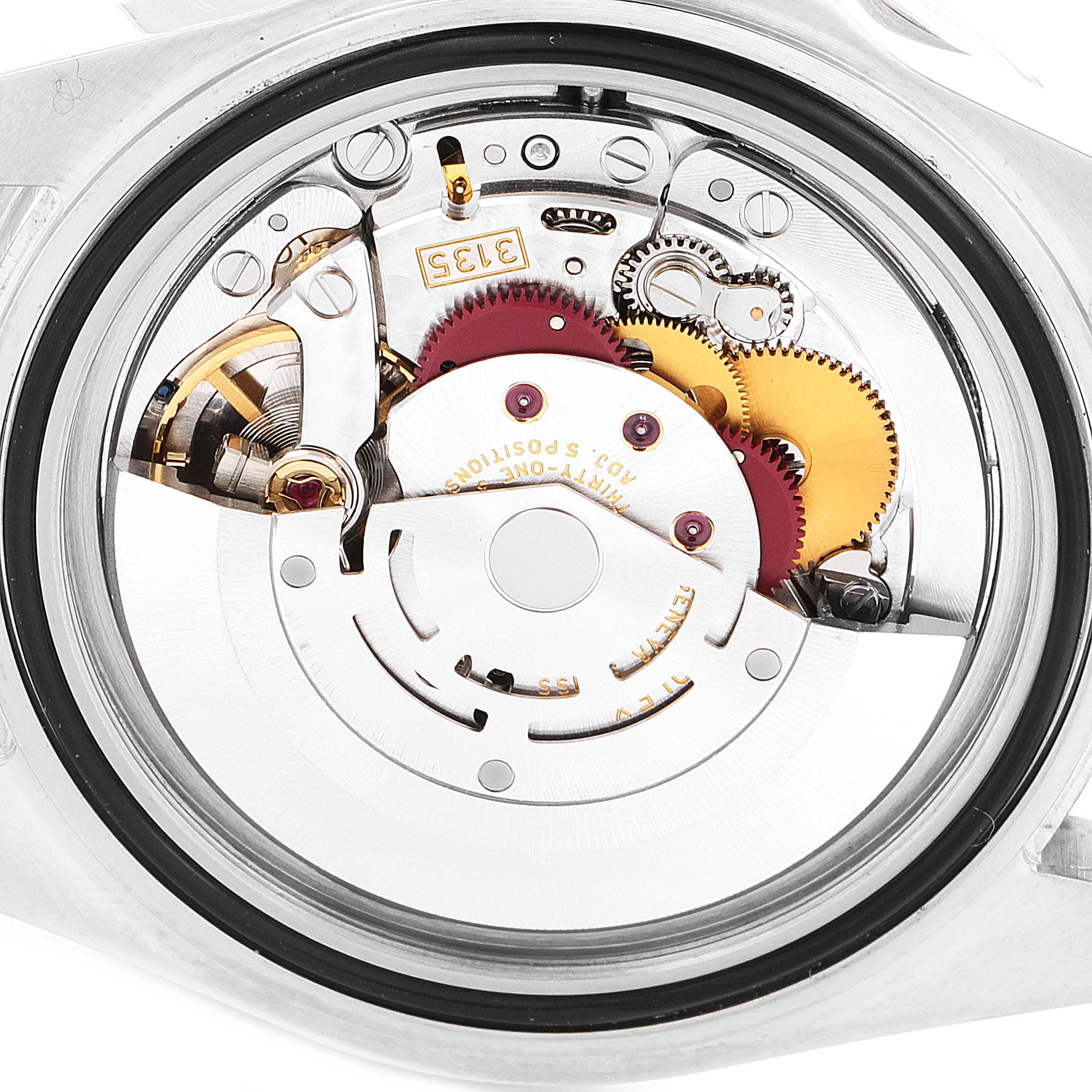 The image shows a close-up view of the movement inside a Rolex Submariner 16610 Men
s Stainless Steel Black Dial 16610 Men
s Stainless Steel Black Dial watch.