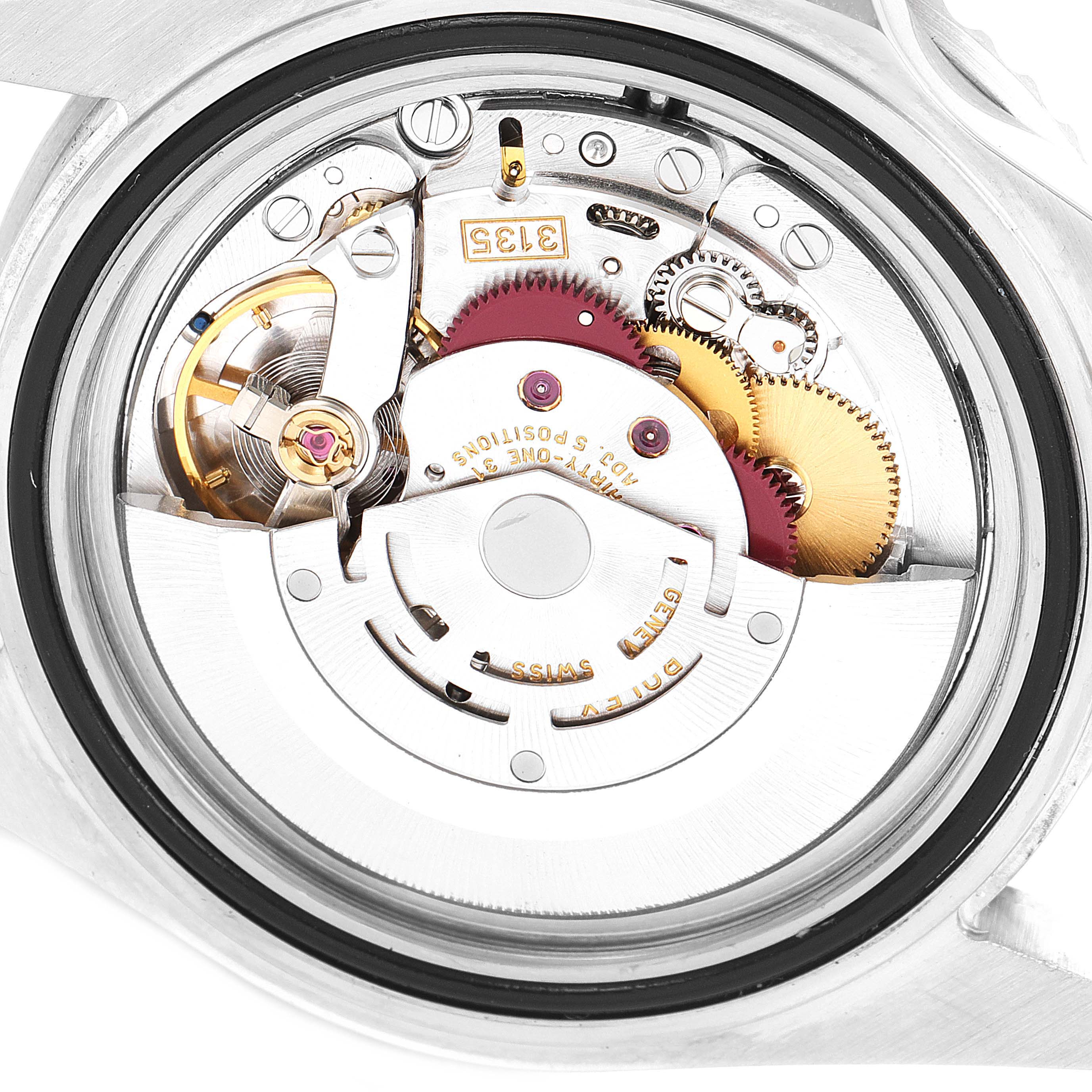 The image shows the movement and internal mechanisms of the Rolex Submariner 16610LV Men
s Stainless Steel Black Dial 16610LV Men
s Stainless Steel Black Dial watch from an open case back angle.
