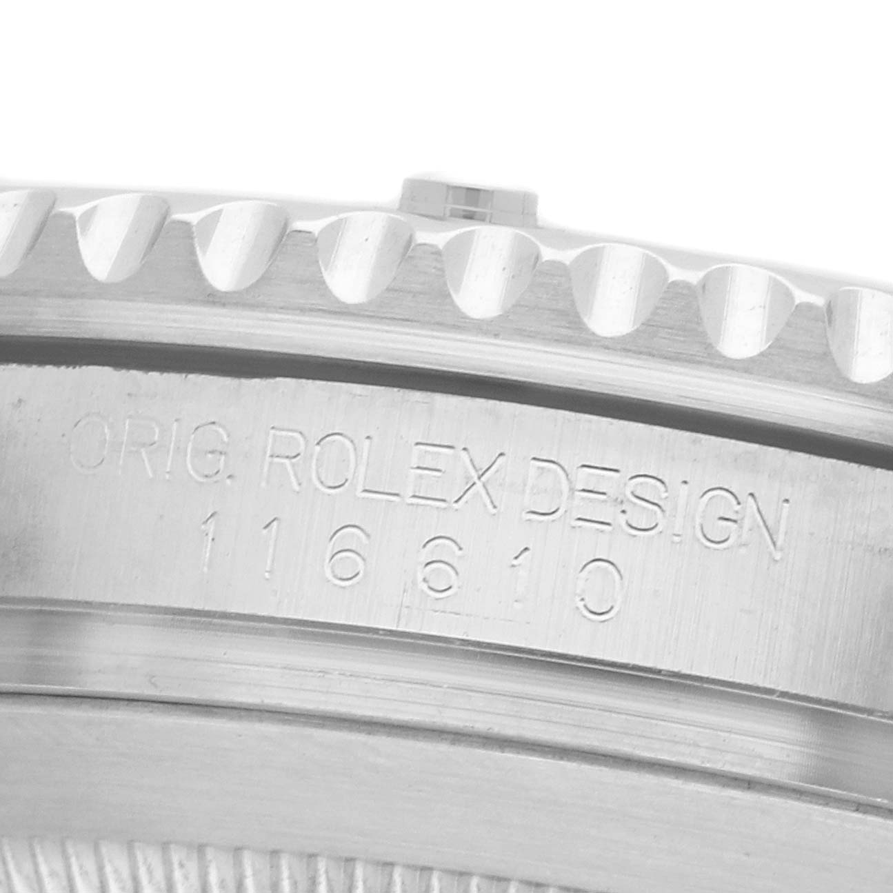 The image shows a close-up of the side engraving on the bezel of a Rolex Submariner 116610LV Men's Stainless Steel Green Dial, revealing model details.