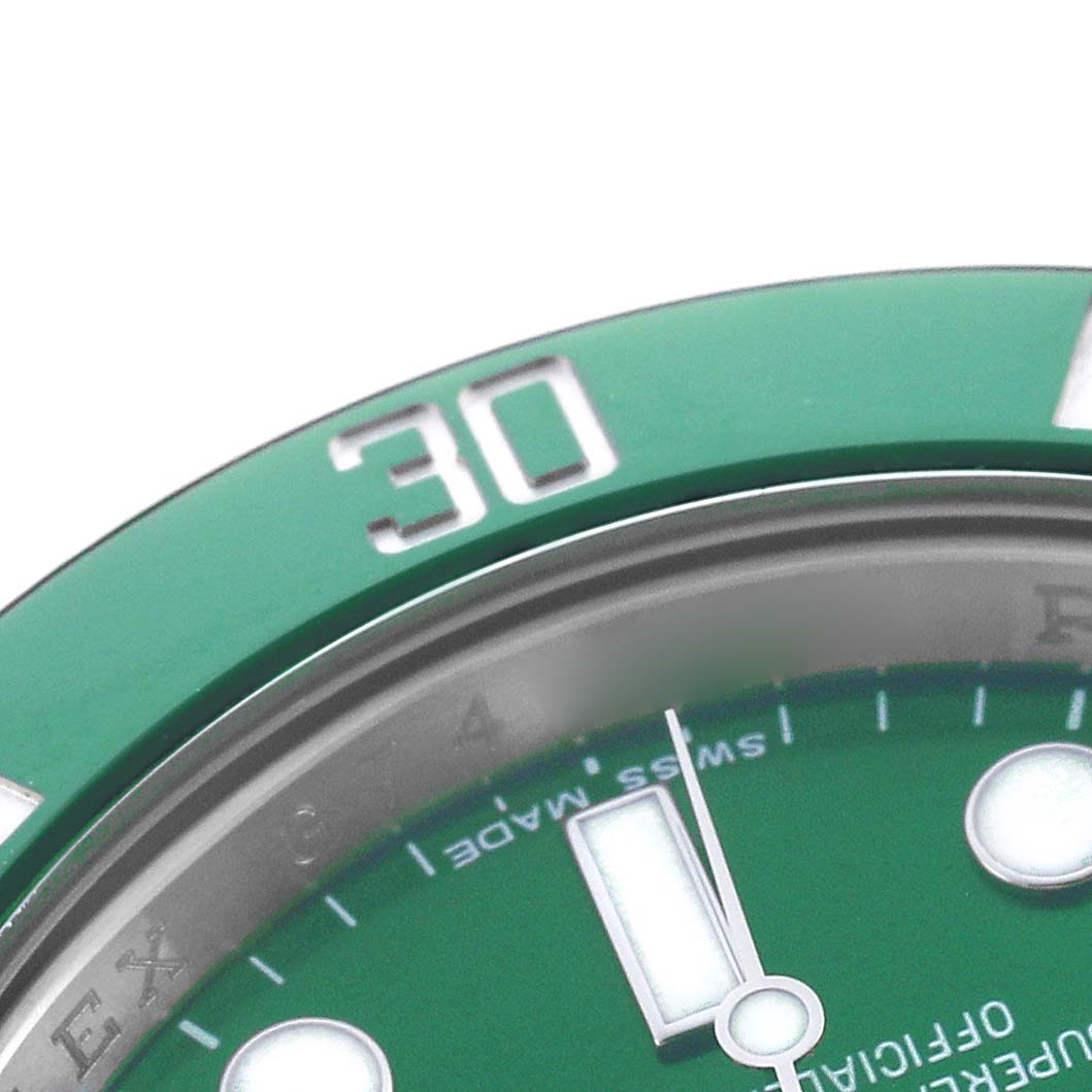 The image shows a close-up of the green bezel and part of the dial of a Rolex Submariner 116610LV Men's Stainless Steel Green Dial watch, highlighting the "30" marker.