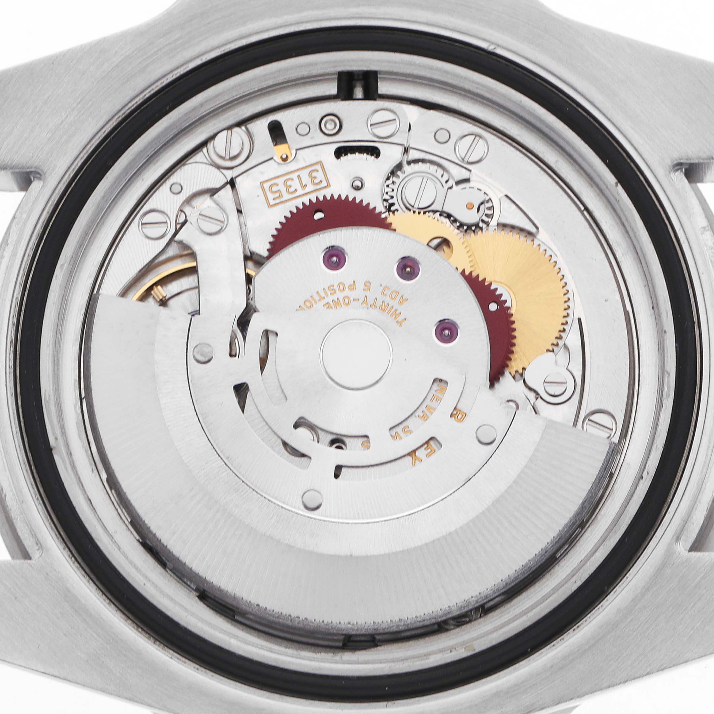 This image shows the internal mechanism of a Rolex Submariner 116610LV Men's Stainless Steel Green Dial, highlighting gears and components.