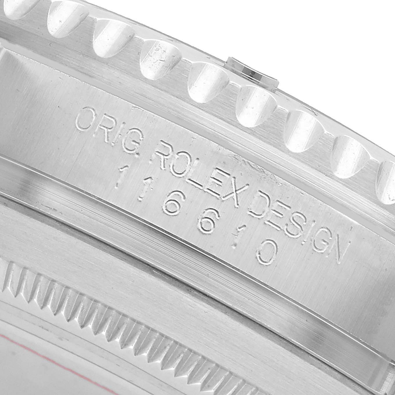 The image shows a close-up of the side of a Rolex Submariner 116610LV Men's Stainless Steel Green Dial, focusing on its engraved bezel and case details.