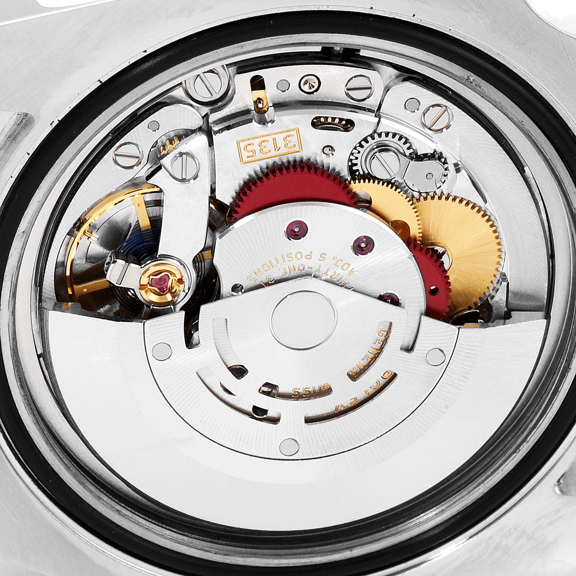 This close-up image shows the intricate movement mechanism of a Rolex Submariner 116613 Men's Steel and Gold (two tone) Blue Dial 116613 Men's Steel and Gold (two tone) Blue Dial watch from the back.