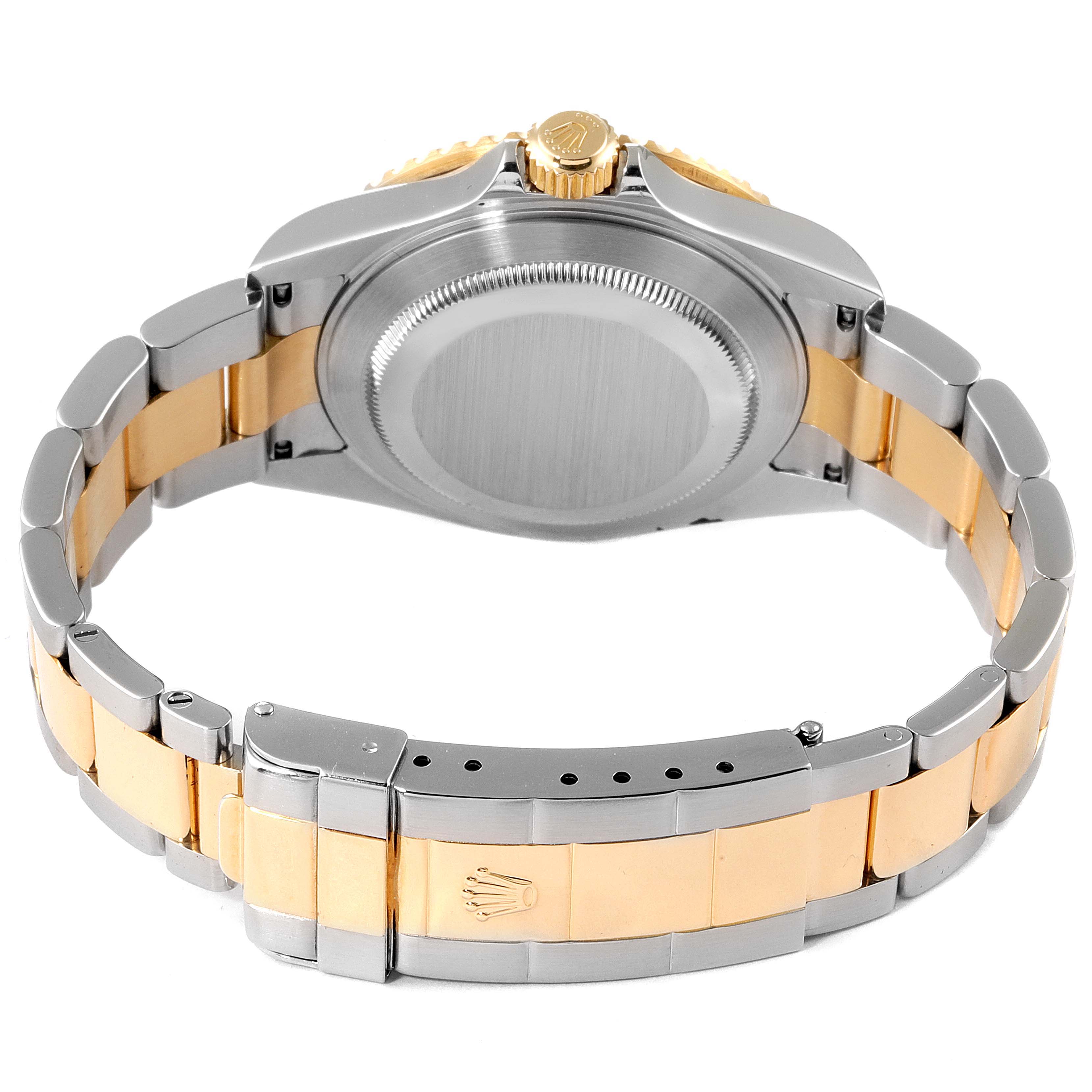 The image shows the back and clasp of a Rolex Submariner 16613 Men's Steel and Gold (two tone) Grey Dial 16613 Men's Steel and Gold (two tone) Grey Dial watch, highlighting its two-tone metal bracelet.