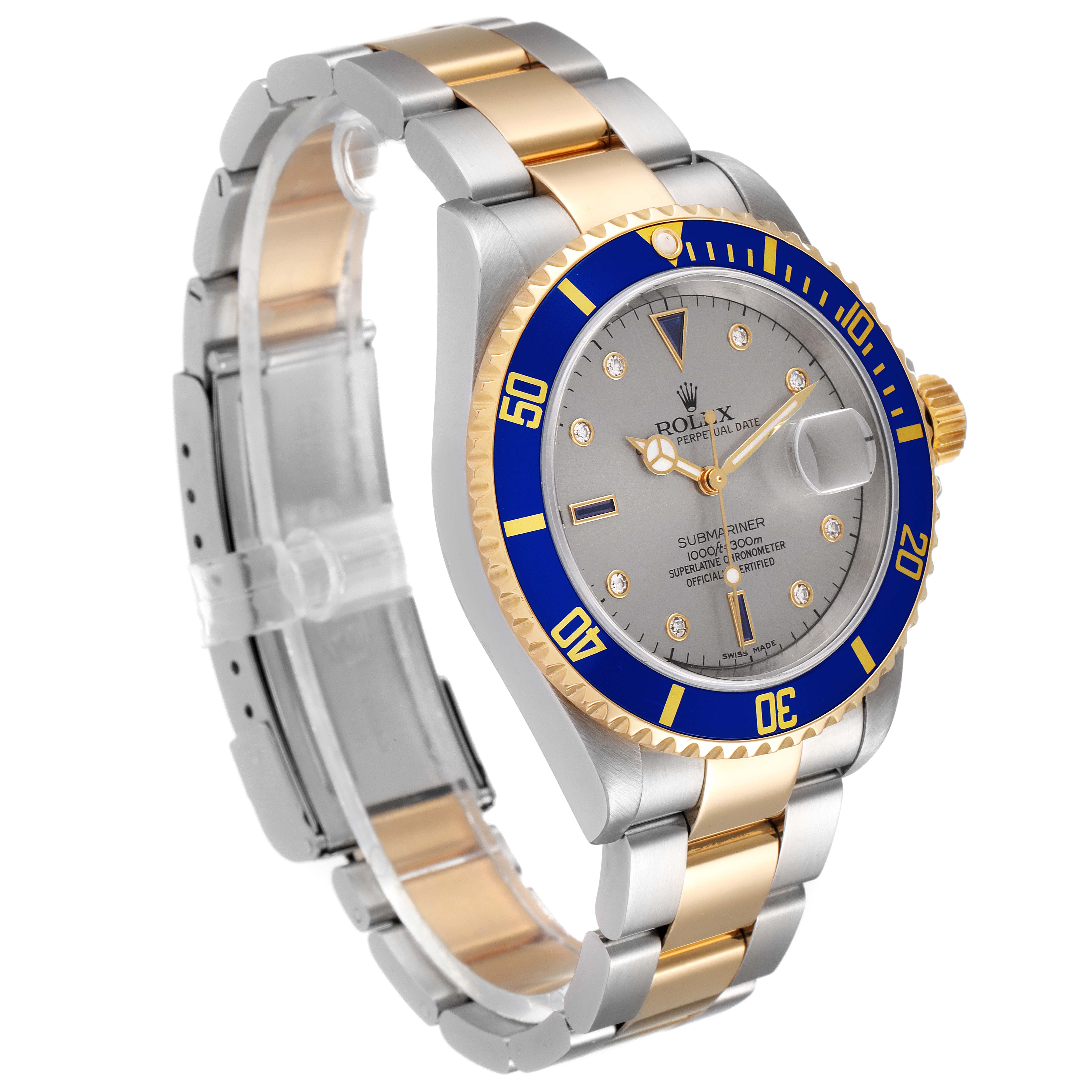 The image shows a Rolex Submariner 16613 Men's Steel and Gold (two tone) Grey Dial 16613 Men's Steel and Gold (two tone) Grey Dial watch at a three-quarter angle, highlighting its two-tone bracelet and blue bezel.