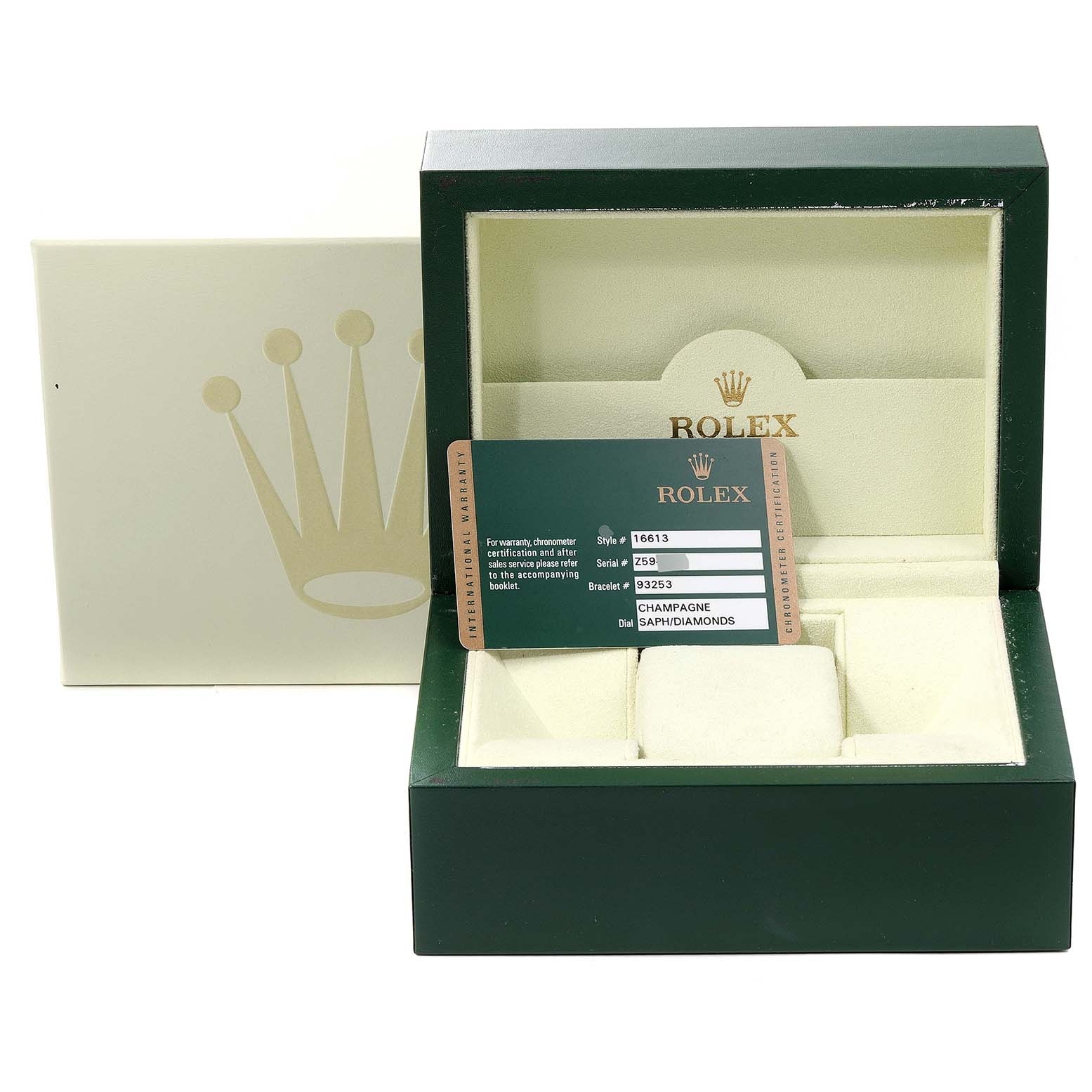 This image shows an open Rolex Submariner 16613 Men's Steel and Gold (two tone) Champagne Dial 16613 Men's Steel and Gold (two tone) Champagne Dial watch box along with the warranty card from a front angle.