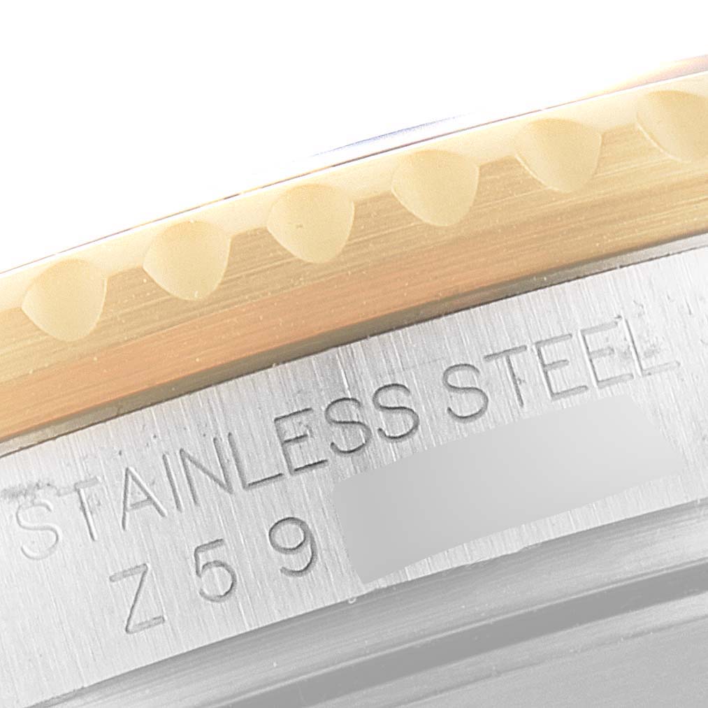 This close-up image shows the grooved bezel and part of the stainless steel case of the Rolex Submariner 16613 Men's Steel and Gold (two tone) Champagne Dial 16613 Men's Steel and Gold (two tone) Champagne Dial watch.