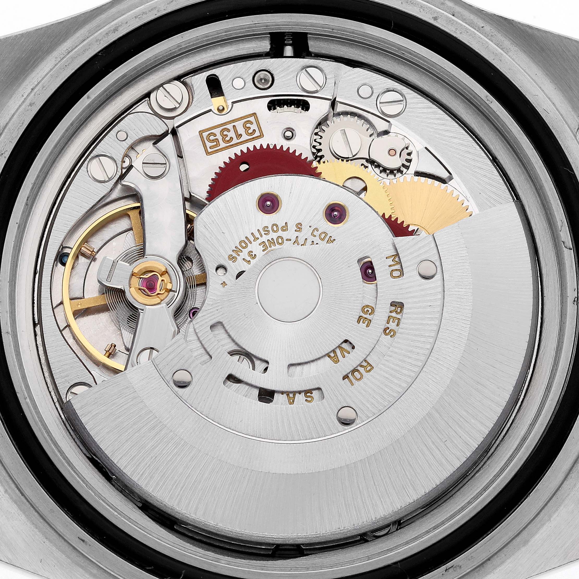 The image shows a close-up of the movement inside a Rolex Submariner 16613SG Men's Steel and Gold (two tone) Silver Dial 16613SG Men's Steel and Gold (two tone) Silver Dial.