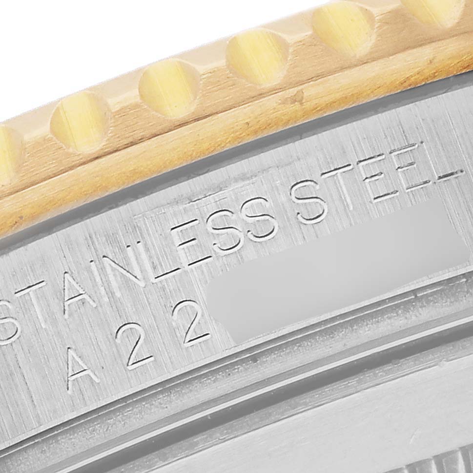 The image shows a close-up of the bezel and engraved details of a Rolex Submariner 16613SG Men's Steel and Gold (two tone) Silver Dial 16613SG Men's Steel and Gold (two tone) Silver Dial watch.