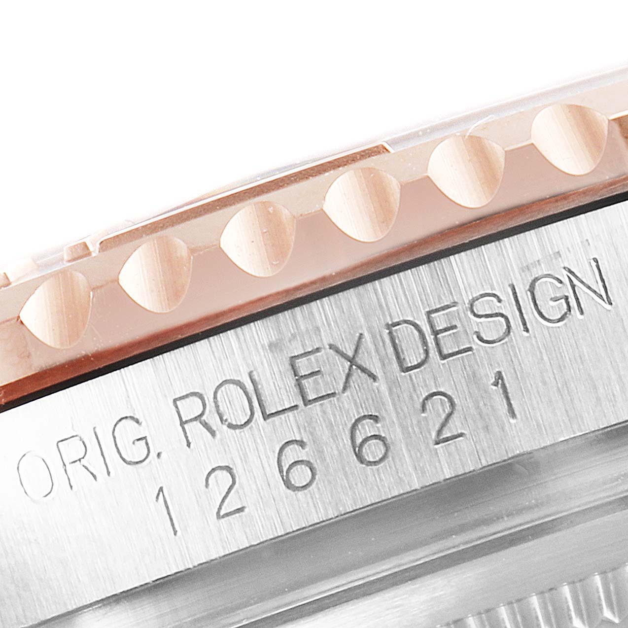 The image shows a close-up of the Rolex Yacht-Master 126621 Men's Rose Gold Black Dial 126621 Men's Rose Gold Black Dial's bezel and case, displaying the model number and "ROLEX DESIGN" engraving.