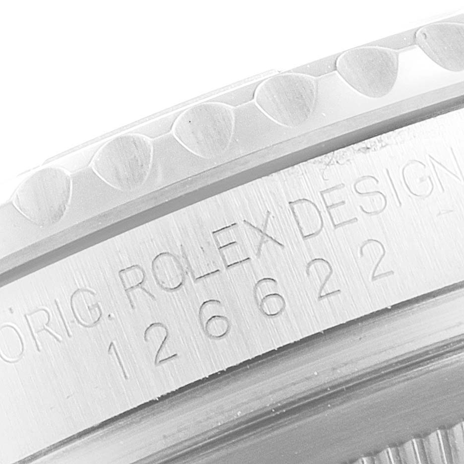 This image shows a close-up of the Yacht-Master Rolex watch bezel and part of the case with engraved text.