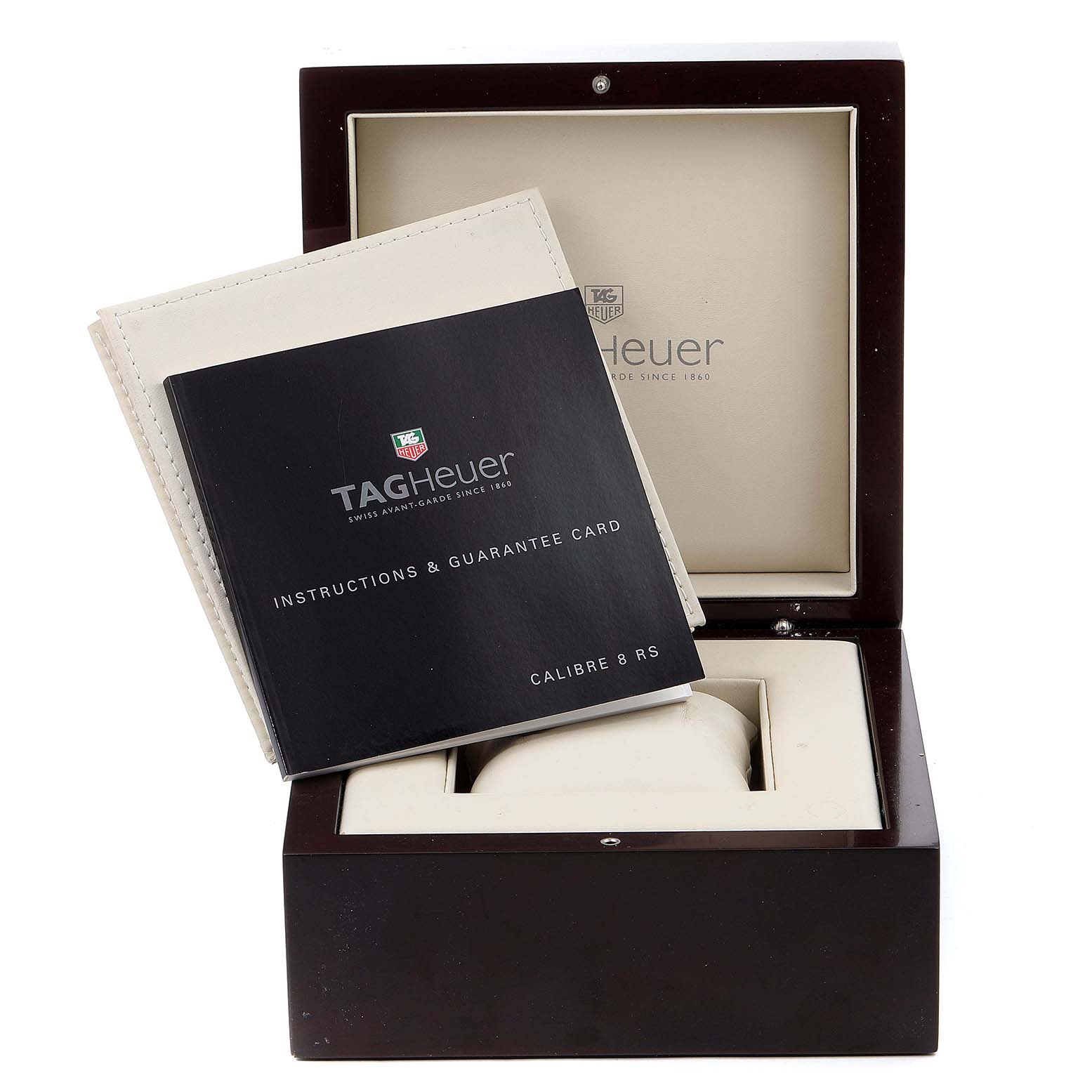The image shows a Tag Heuer Carrera WAV5111.BA0901 Men
s Stainless Steel Black Dial WAV5111.BA0901 Men
s Stainless Steel Black Dial watch box with an instruction manual and guarantee card placed inside.