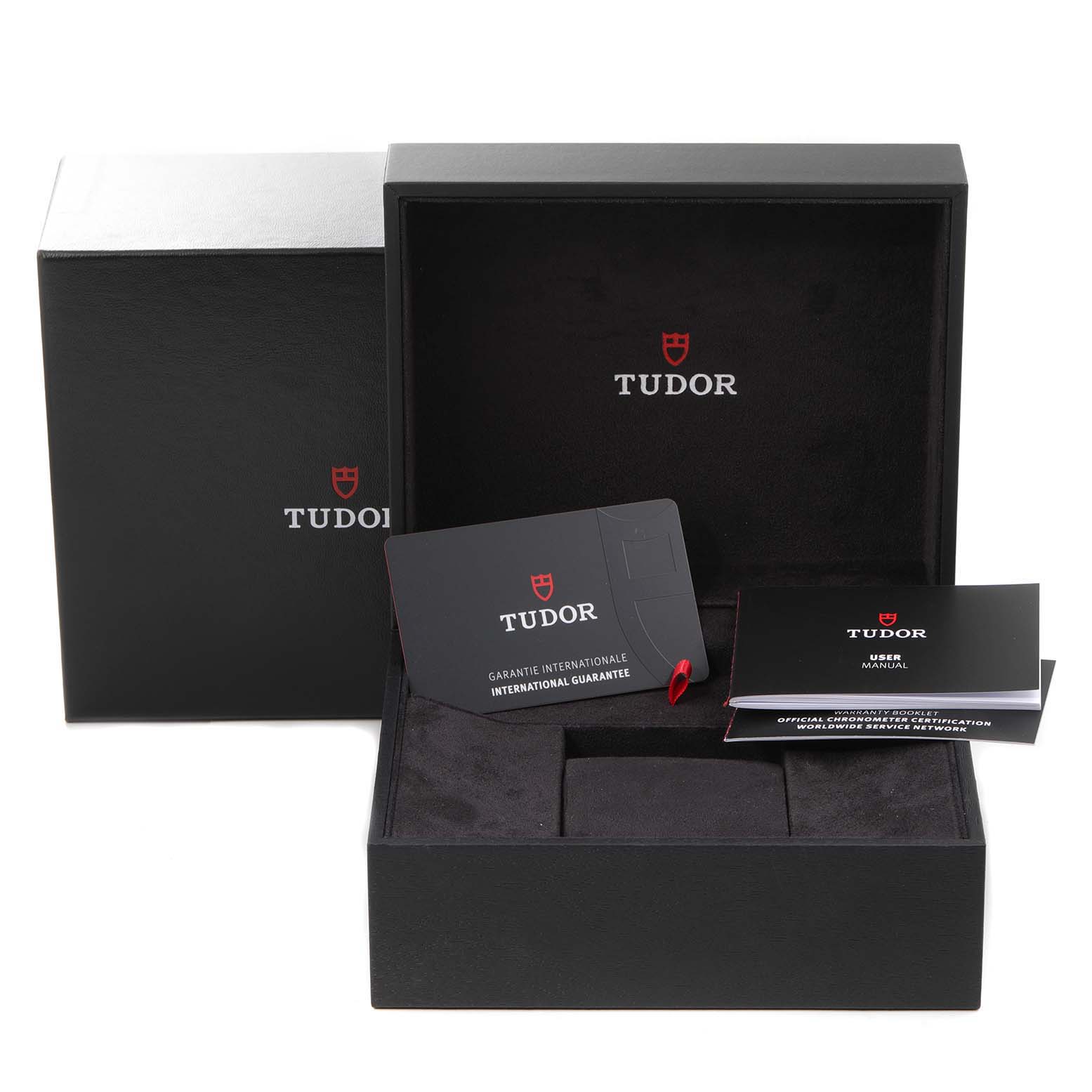 The image shows the Tudor Heritage Black Bay 79830RB Men's Stainless Steel Black Dial 79830RB Men's Stainless Steel Black Dial watch box, international guarantee card, and user manual from a frontal angle.