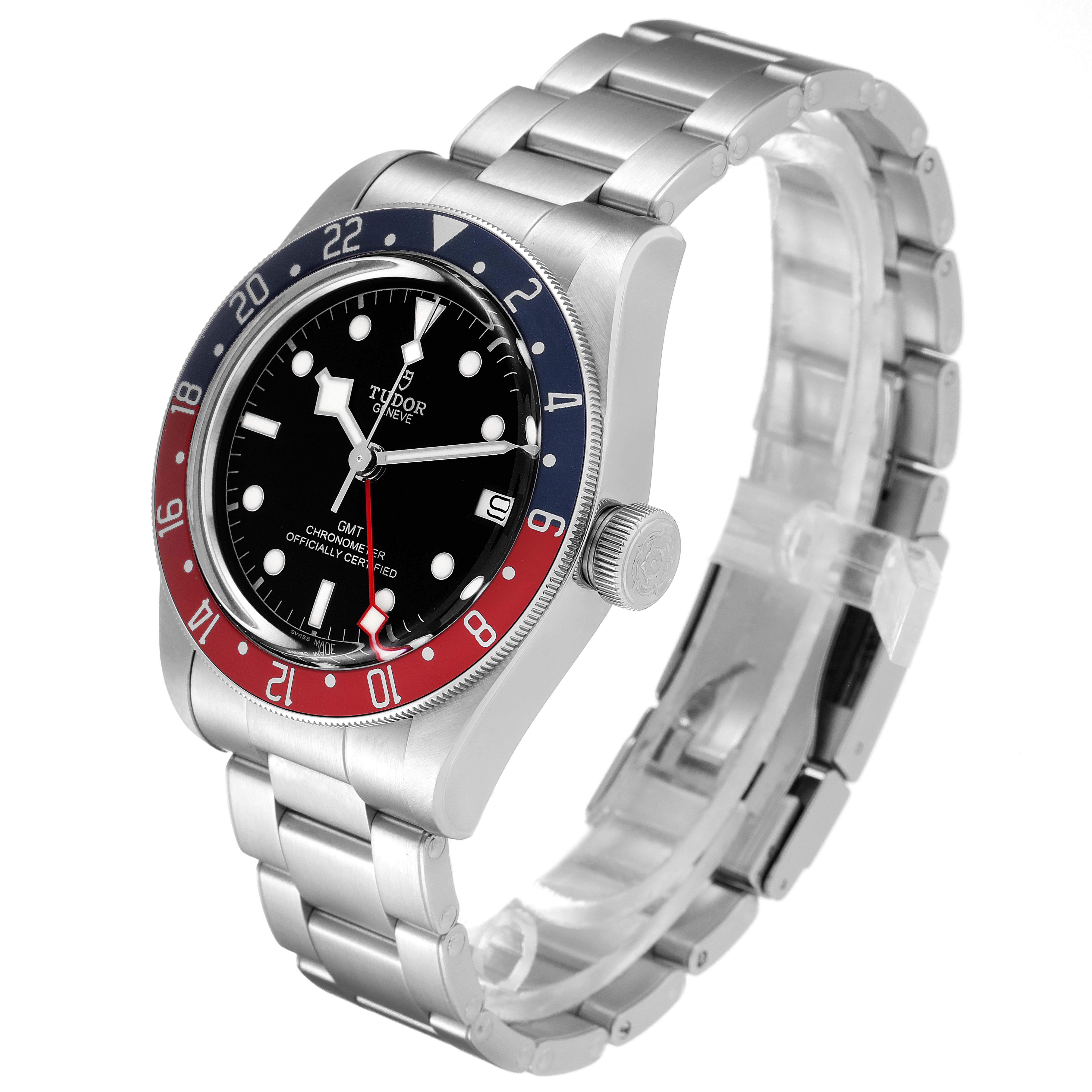 The Heritage Black Bay watch by Tudor is shown at a three-quarter angle, highlighting its bezel, face, and bracelet.