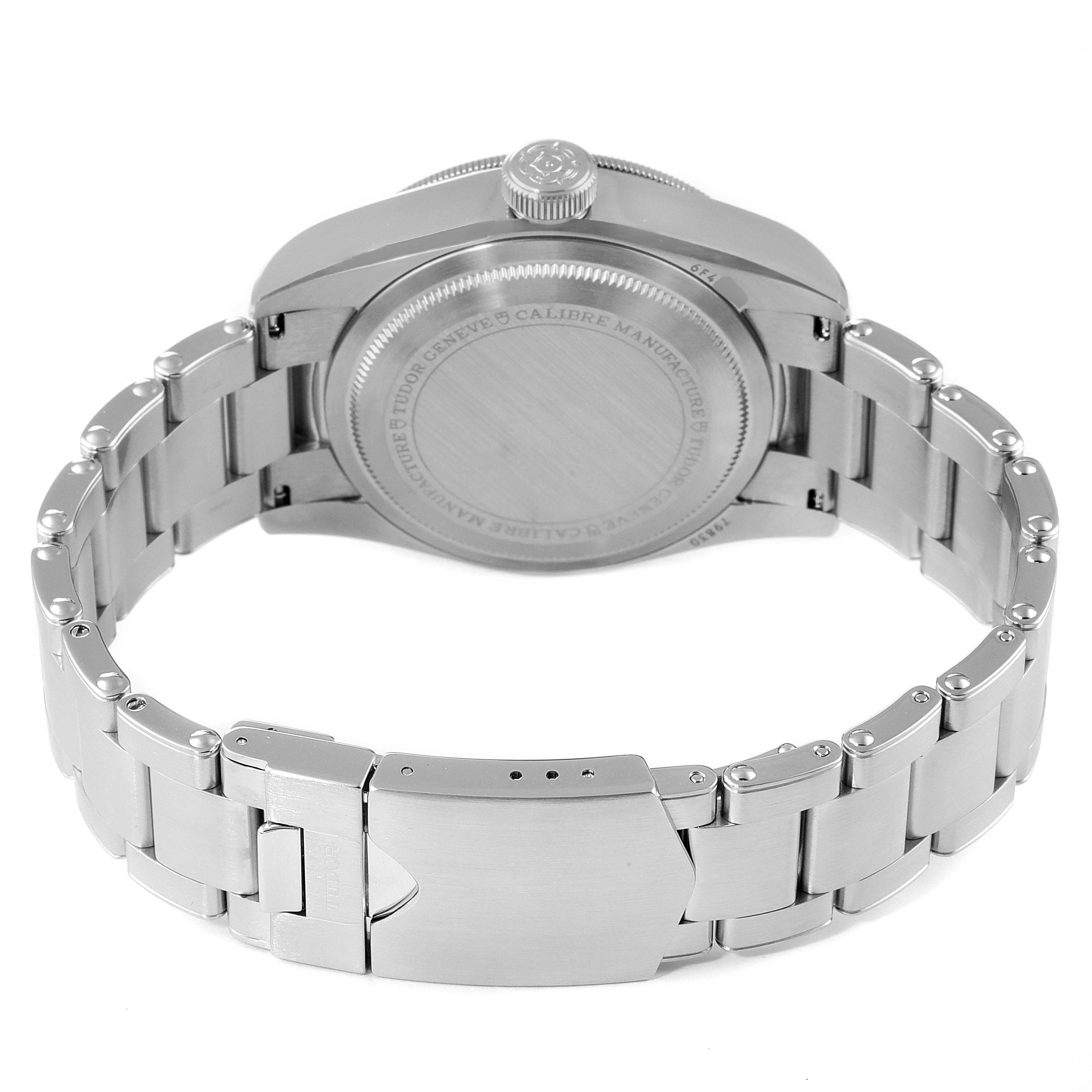 The image shows the back view of a Tudor Heritage Black Bay 79830RB Men's Stainless Steel Black Dial 79830RB Men's Stainless Steel Black Dial watch, highlighting the case back and metal bracelet.