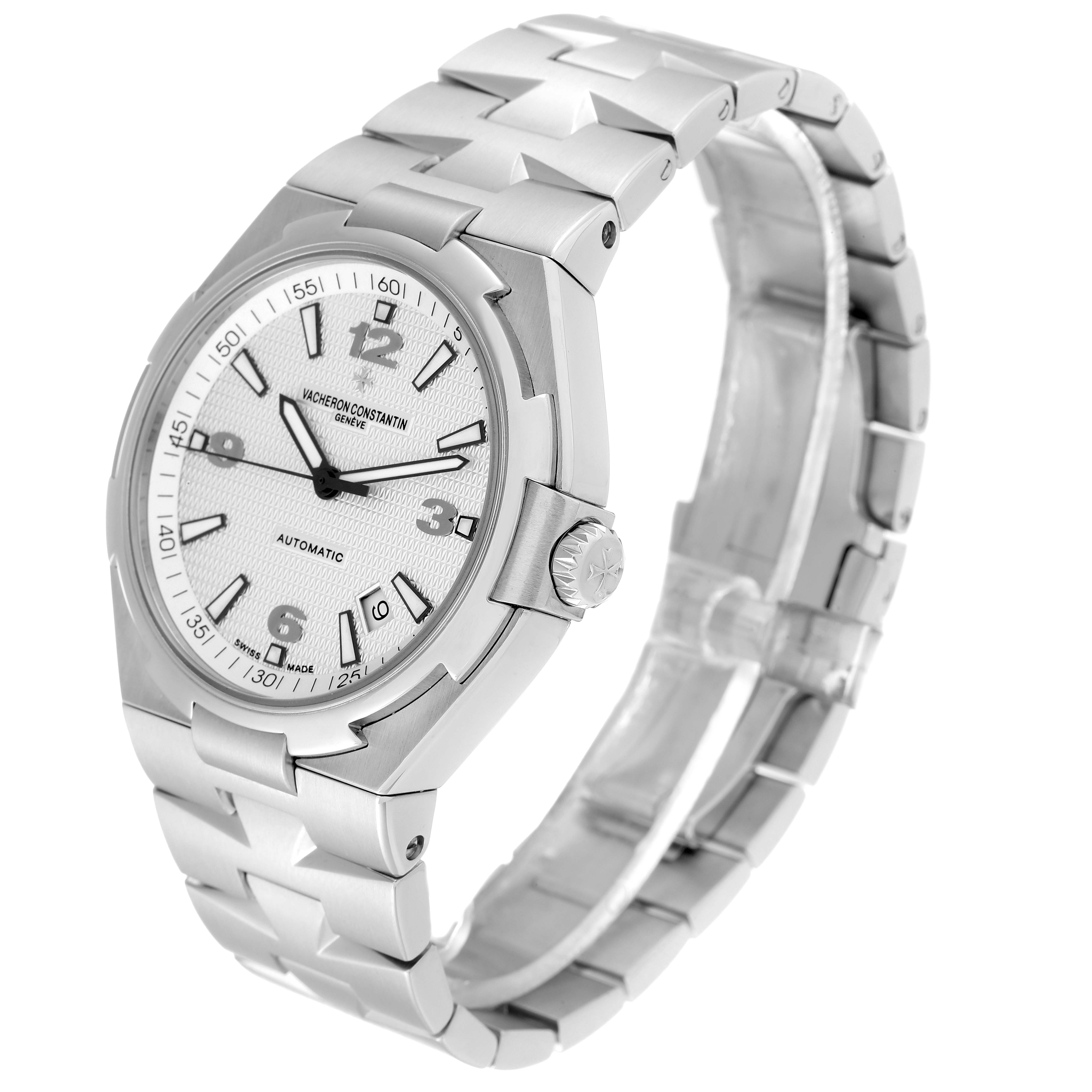 The image shows a Vacheron Constantin Overseas 47040 Men's Stainless Steel Silver Dial 47040 Men's Stainless Steel Silver Dial watch in a three-quarter view, highlighting its face, bezel, crown, and bracelet.