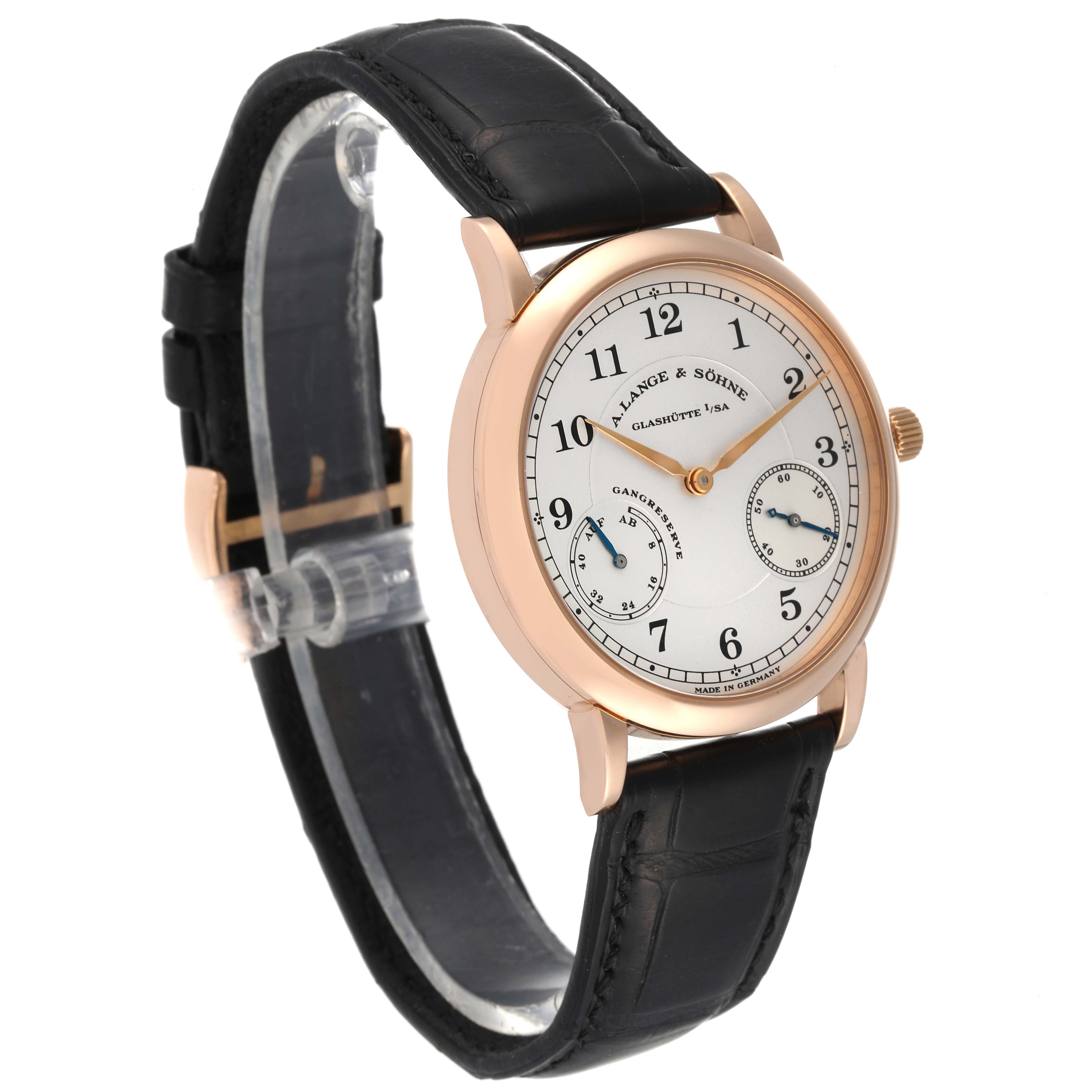 The A. Lange & Sohne 1815 221.032 Men's Rose Gold Silver Dial model watch is shown at a slight angle, displaying its dial, case, crown, and leather strap.